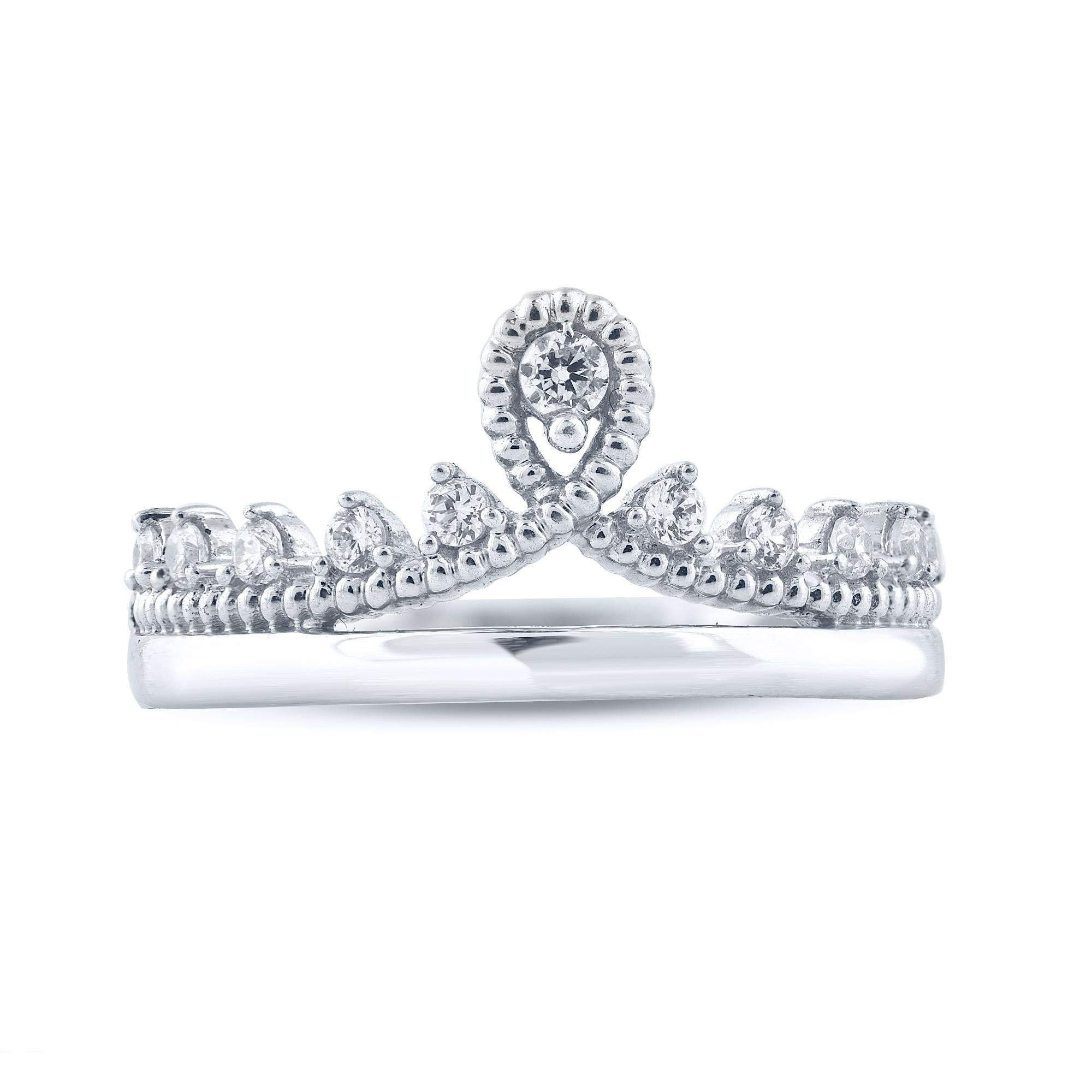 This Princess Tiara Ring is expertly crafted in 14 Karat white gold and features 11 brilliant cut round diamonds set in prong setting. The diamonds are graded as H-I color and I2 clarity. This princess tiara ring has high polish finish and is a