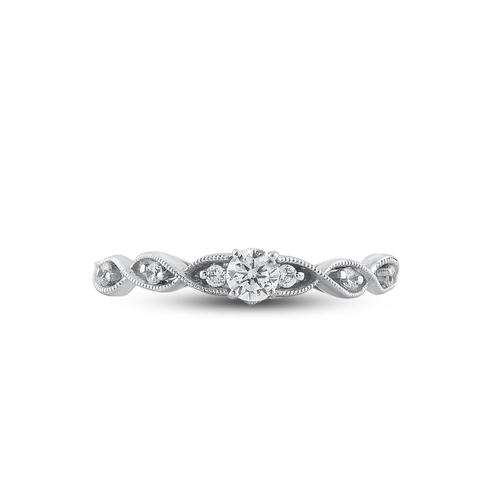 Win her heart with this classic and elegant diamond wedding ring. These diamond ring are studded with 7 brilliant cut round diamonds in prong setting and crafted in 14kt white gold. The white diamonds are graded as H-I color and I2 clarity and a