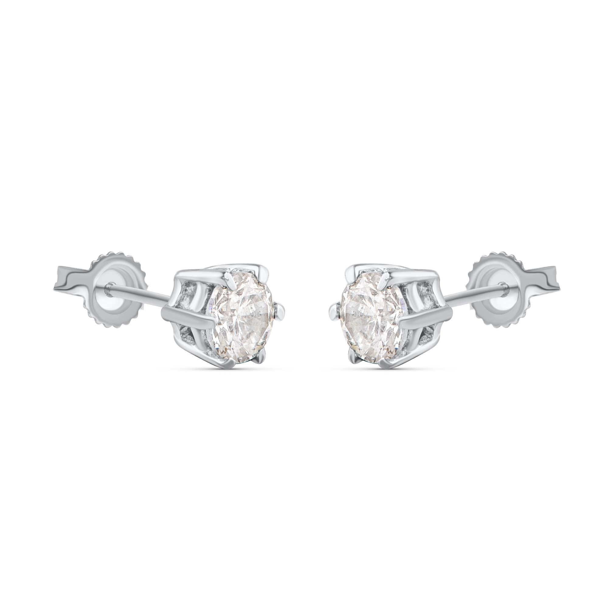 Shines brightly with two brilliant-cut diamonds set in prong setting and beautifully crafted in 18-karat white gold. Diamonds are graded H Color, I1 Clarity and the total diamond weight is 0.25 carats. These stud earrings secure easily with post and