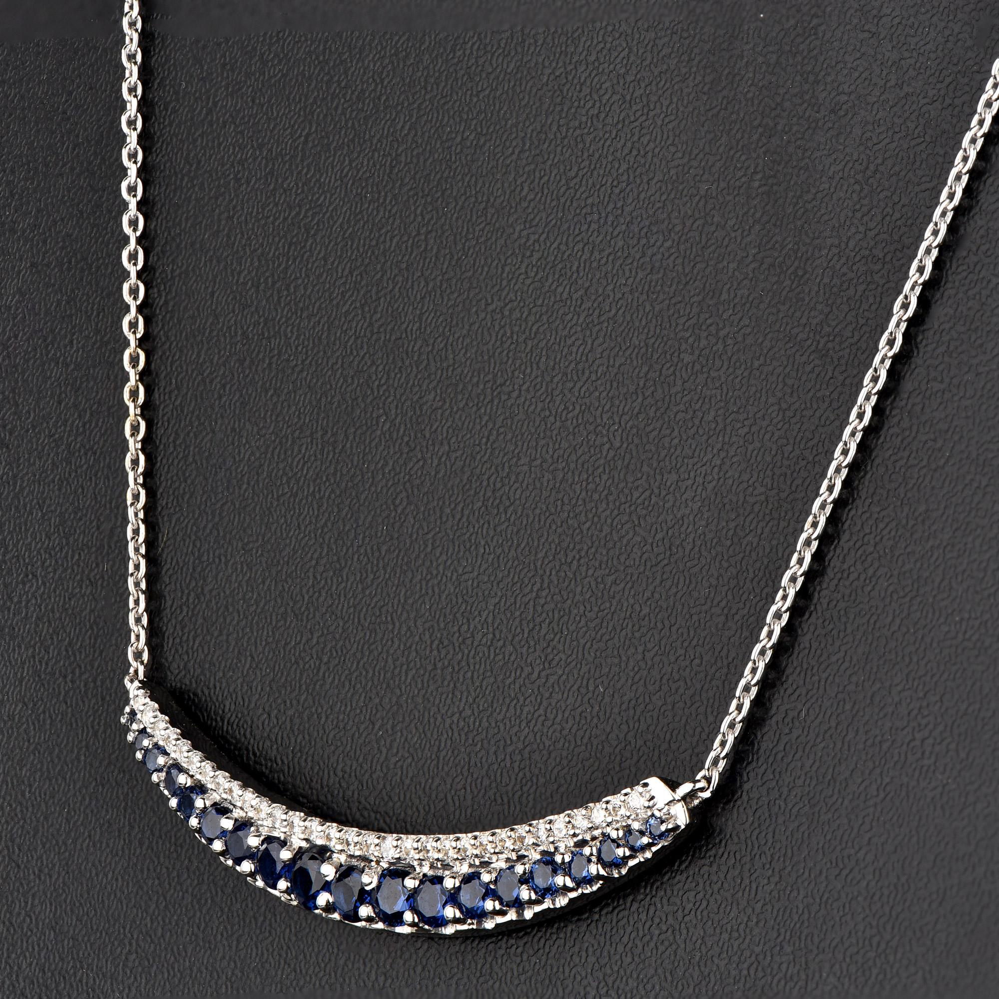 A striking addition when worn on its own, this diamond pendant makes a stunning impression. The pendant is crafted from 14 karat gold in your choice of white, rose, or yellow, and features 31 round white diamond and 19 blue sapphire set in pressure