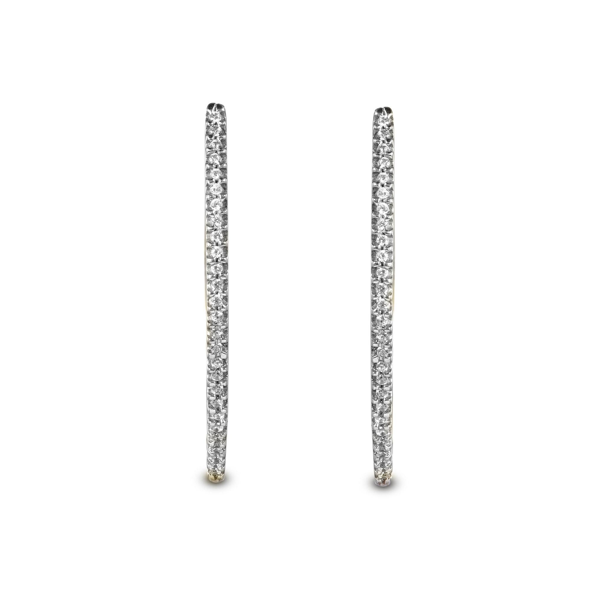 18 Karat Yellow Gold diamond hoop earrings With 54 Round Brilliant Diamonds timeless hoop earrings have 0.25 Carats of Round Brilliant set in prong setting, H-I color I1 clarity. These sparkling hoop earrings secure comfortably with post backs.

