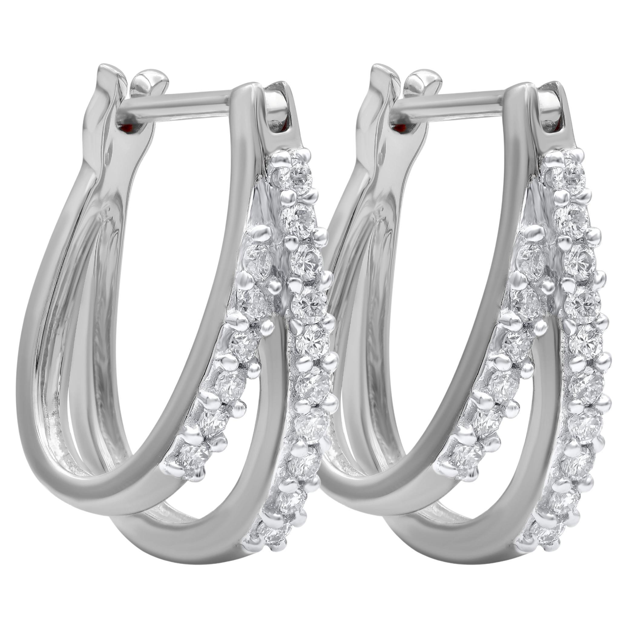 Bring charm to your look with this diamond hoop earrings. This earring is beautifully designed and studded with 32 brilliant cut round diamond set in ribbon setting. We only use natural, 100% conflict free diamonds which shines in H-I Color and I-2