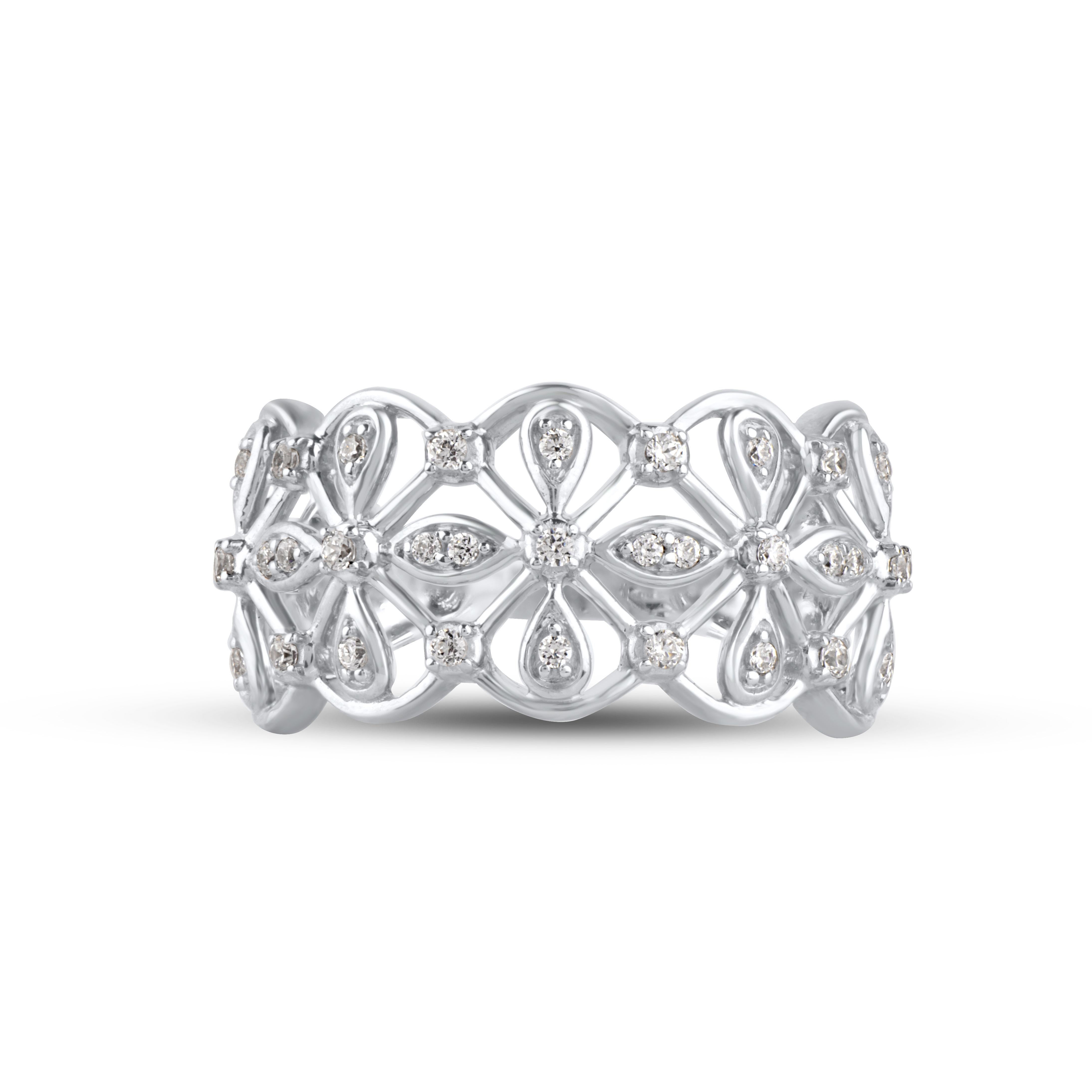 This Vintage Floral Wide Band Ring is expertly crafted in 14 Karat White Gold and features 31 Round cut White diamonds set in pave and prong setting, H-I color I2 clarity in a beautiful design forming a unique pattern. This ring has high polish