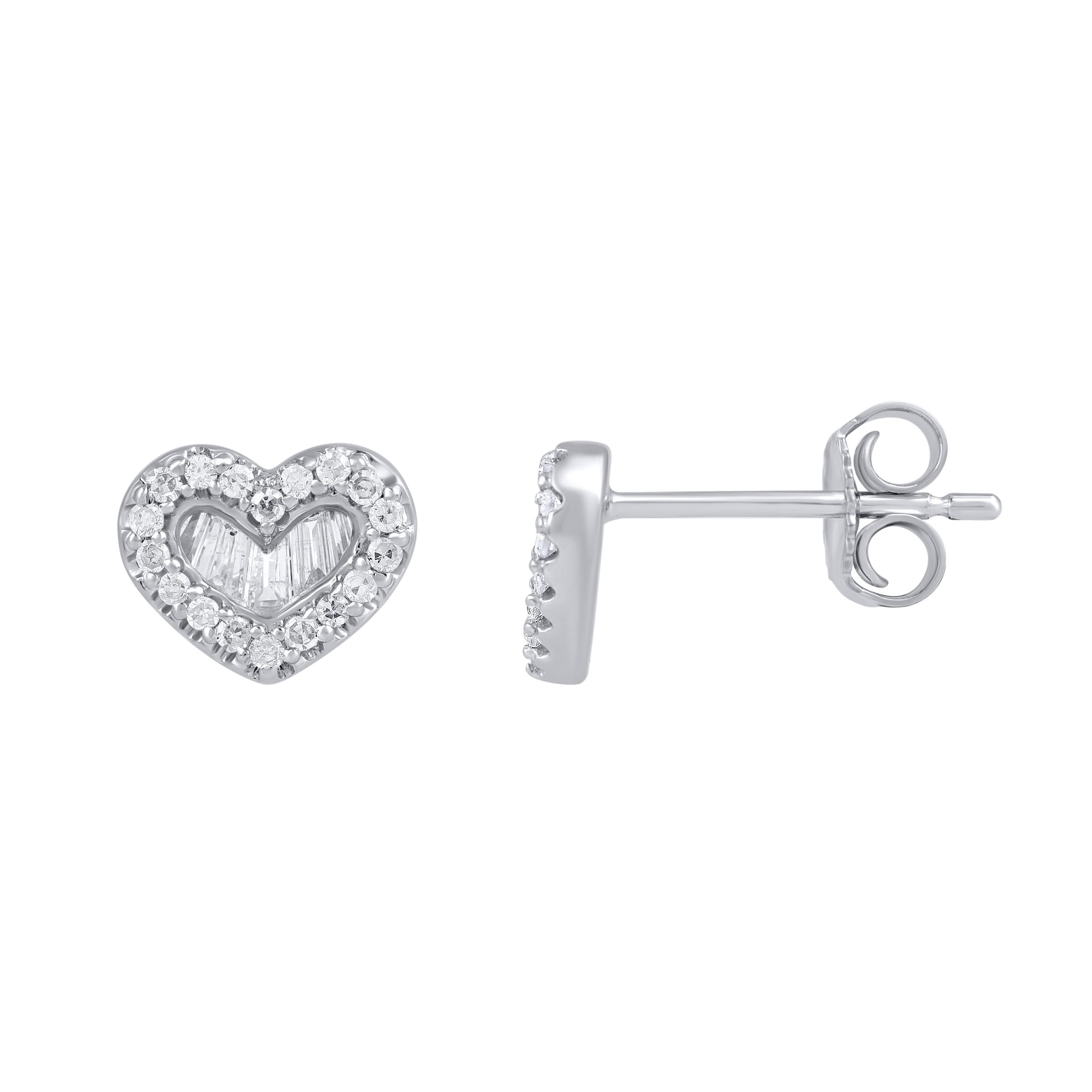 A sparkling delight, these diamond heart stud earrings fit her charming aesthetic. Handcrafted by our experts in 14 karat white gold and studded with 46 single cut and baguette-cut diamond set in prong and channel setting, glitters in H-I color I2