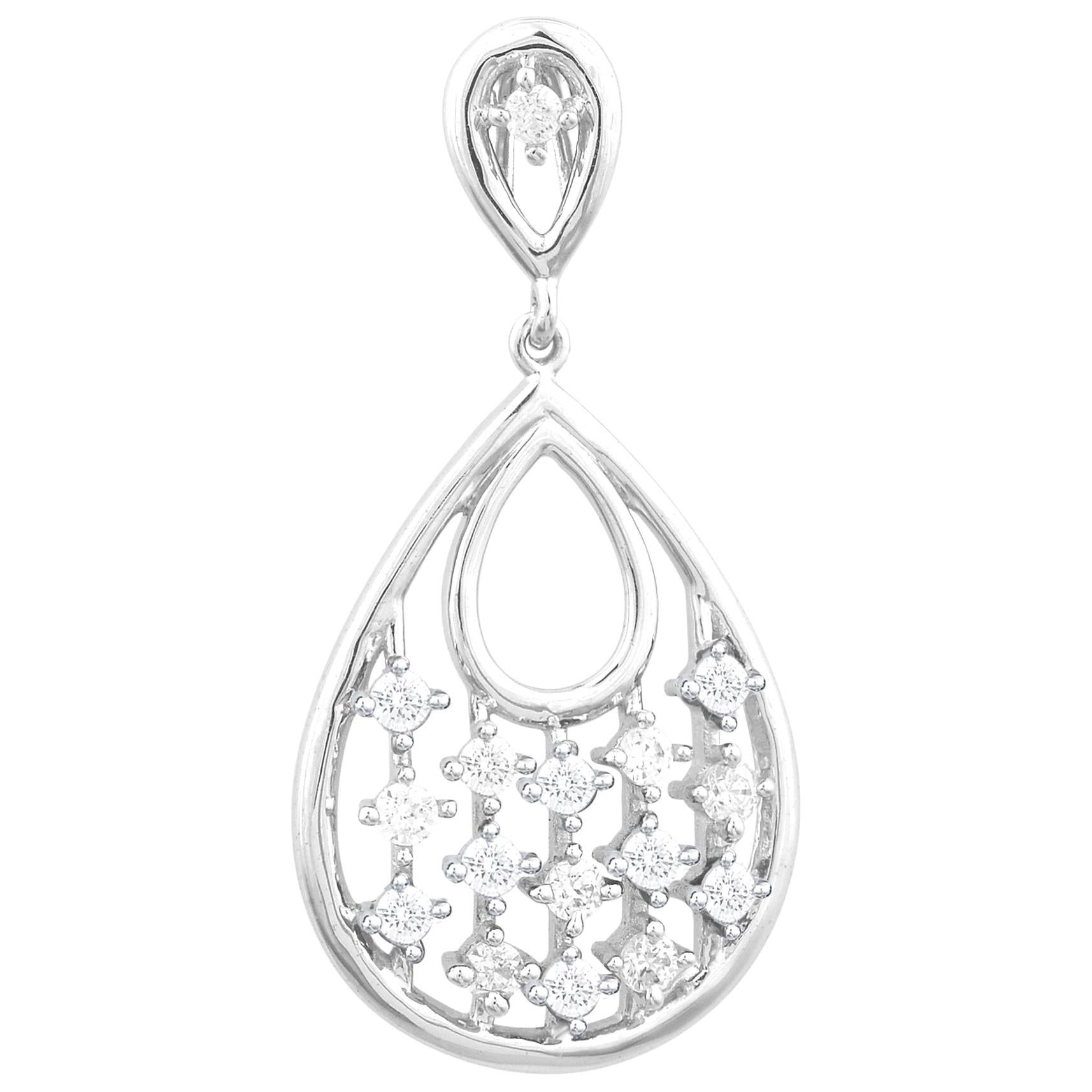 An easy and elegant addition to any attire, this sparkling diamond pear shaped pendant creates a style statement. Accentuated with 16 round diamonds set in prong setting and crafted by skillful craftsmen in 14 karat white gold. The total diamond
