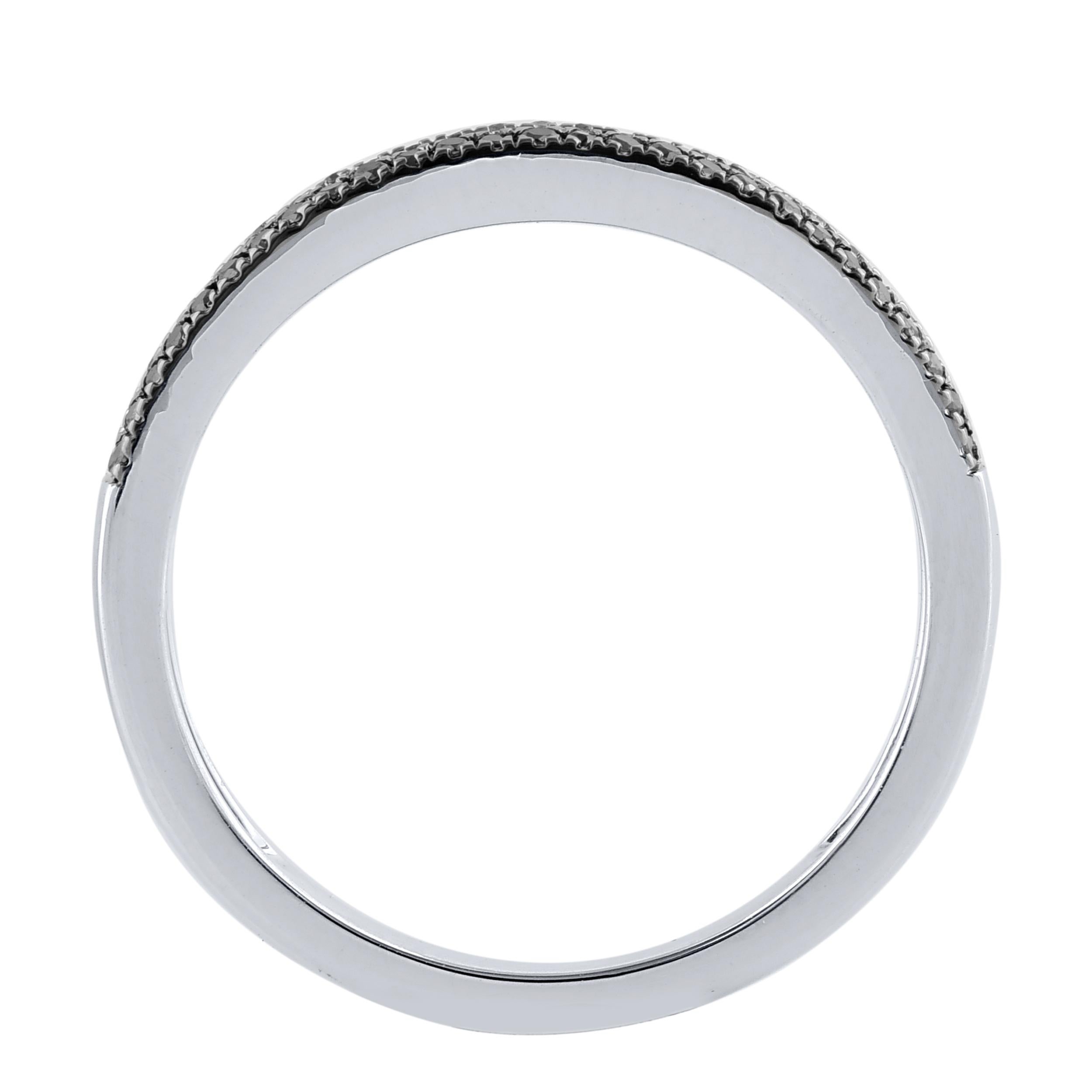 This beautiful stackable band ring features shimmering brilliant cut diamonds and treated black diamond in prong and channel setting. crafted in 14 karat white gold. The ring is studded with a total of 71 brilliant cut natural round diamonds and the