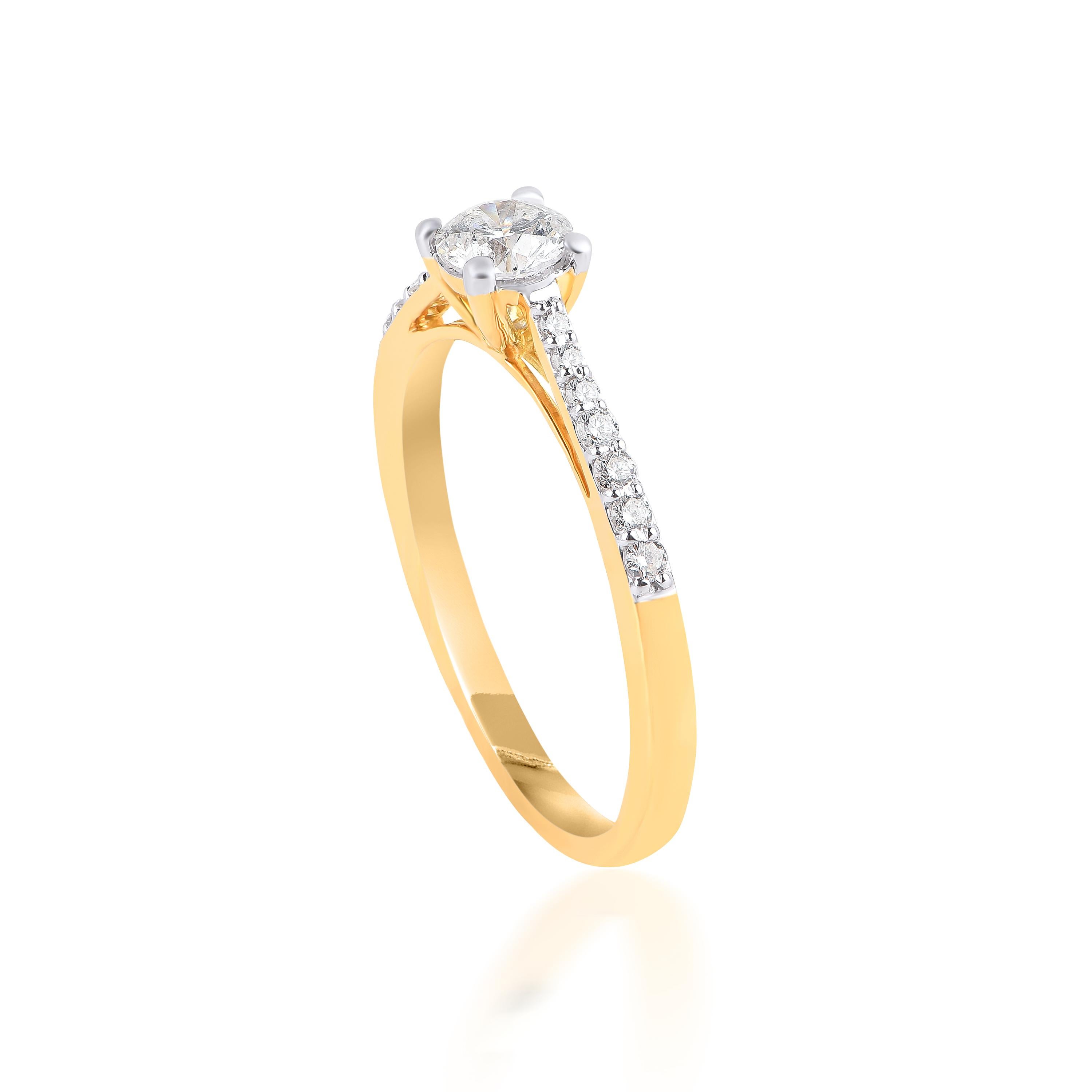 This wedding ring is studded with 15 brilliant-cut diamonds in prong and micro-pave setting and beautifully crafted in 18-karat yellow gold. The diamonds are graded H-I Color, I2 Clarity.