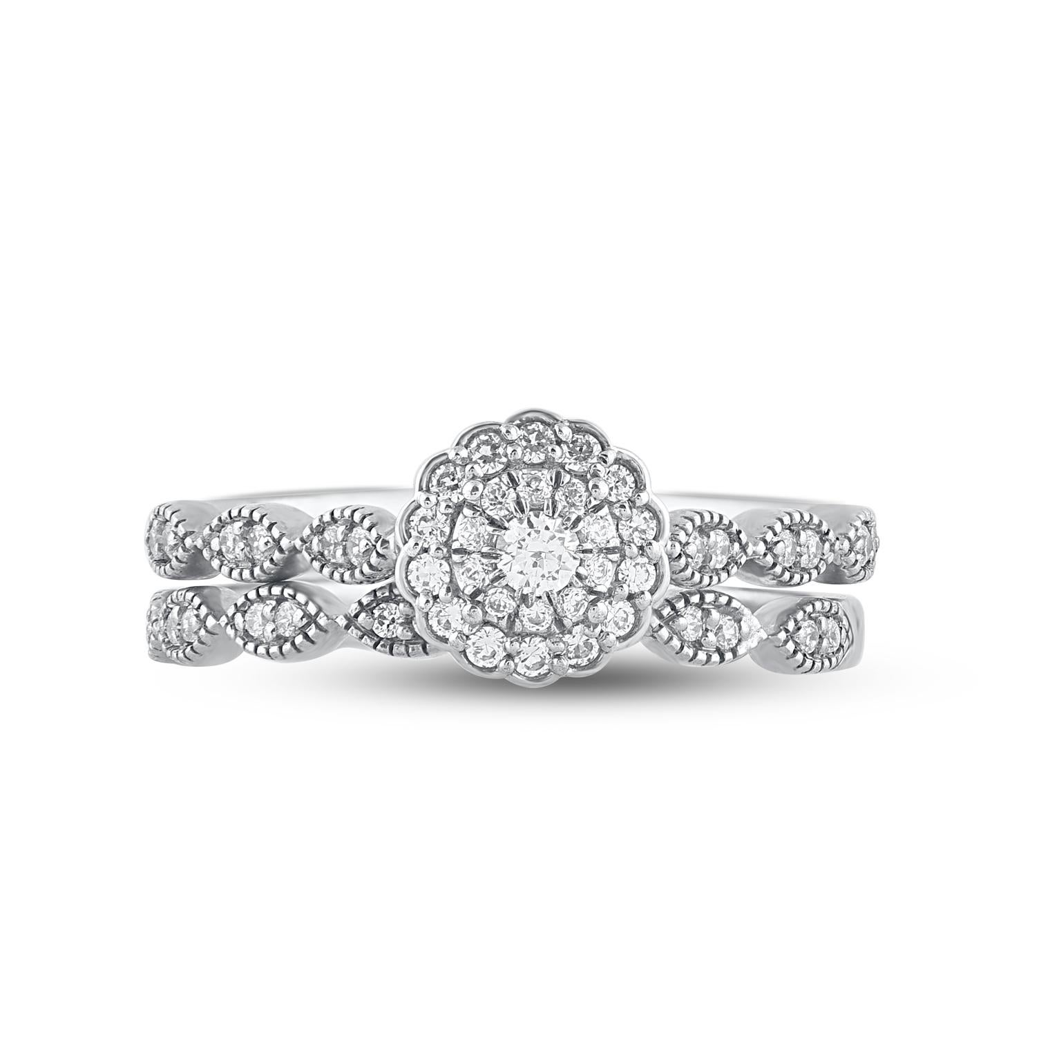 Give her a sophisticated reminder of your love with this diamond ring set. Crafted in 14 Karat white gold. This wedding ring features a sparkling 51 brilliant cut and single cut round diamonds beautifully set in prong & pave setting. The total
