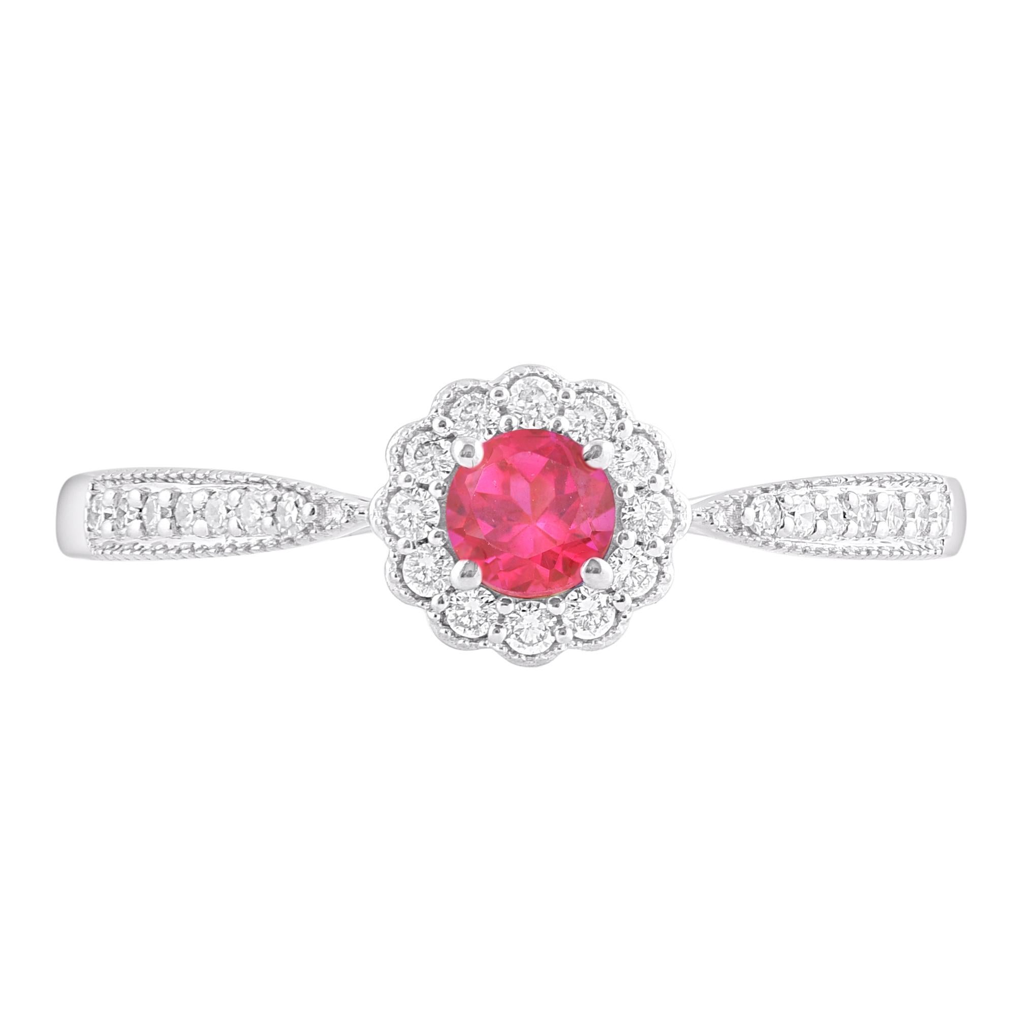 This beautiful diamond and ruby gemstone engagement ring Handcrafted in 14 karat white gold. The 26 round diamond and 1 ruby gemstone elegantly set in prong and pave setting. Diamonds are graded H-I Color, I2 Clarity.  this is a valuable addition to