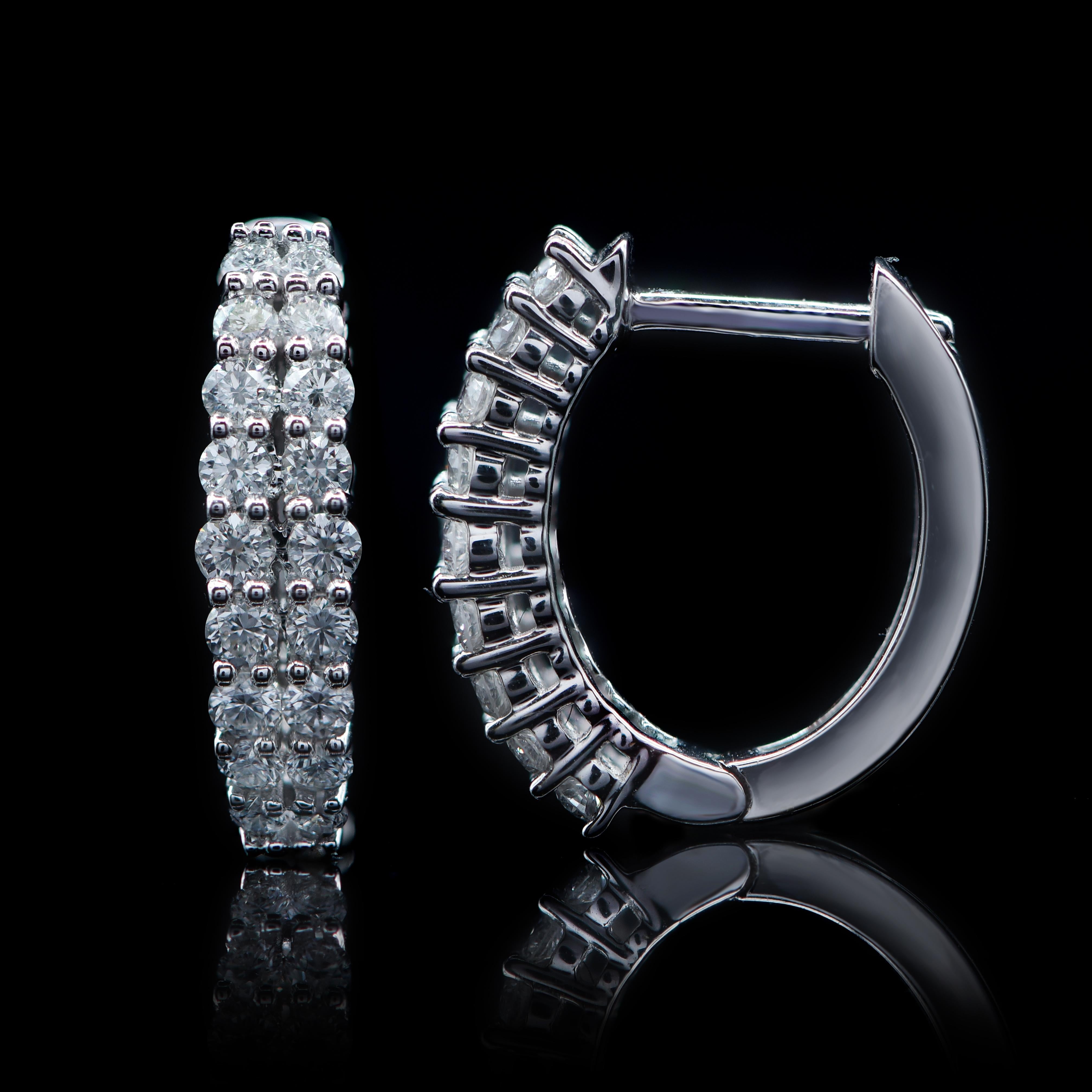 These designer diamond hoops earrings are expertly hand-crafted in 18-karat white gold and embedded with 36 brilliant natural diamonds in prong setting. The diamonds are graded H-I Color, I2 Clarity.