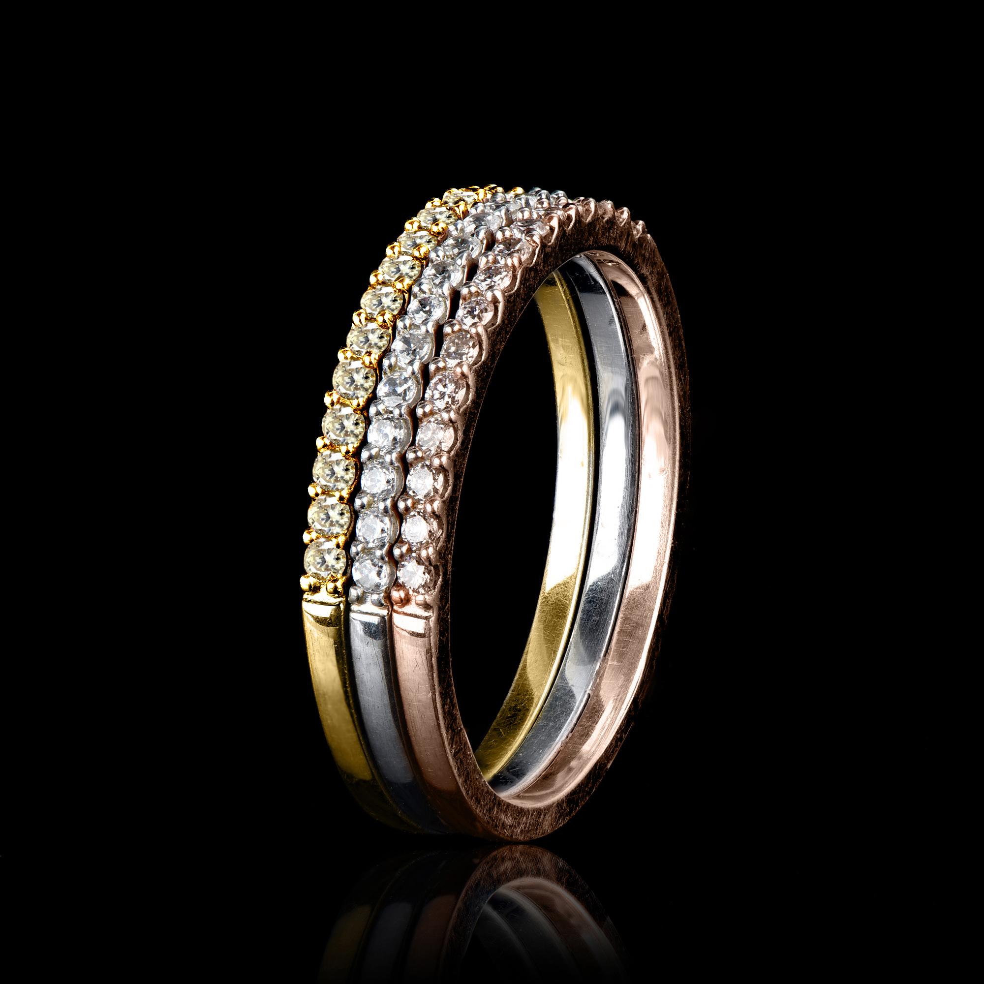 Stackable Band Ring is expertly crafted in 14 Karat and features 15 round cut white and 30 natural pink rosé diamonds set in pave setting. The diamonds are natural, not-treated and conflict-free with H-I color I1 clarity. This ring has high polish