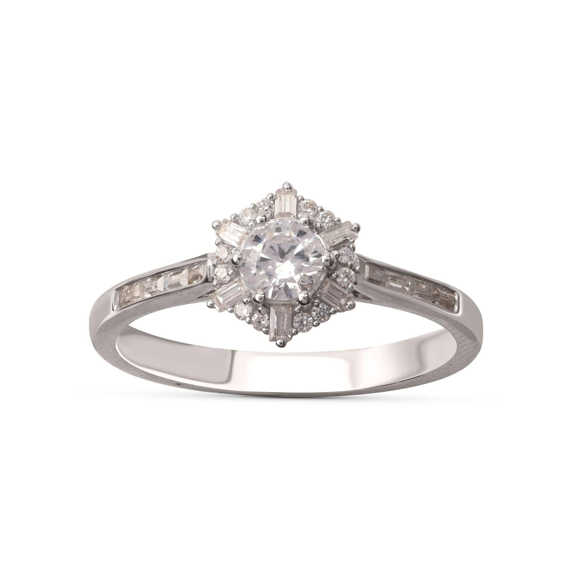 Exquisitely designed in 18-karat white gold and dazzling with 13 brilliant cut and 14 baguette shape diamonds embedded beautifully in channel and prong setting. The diamonds are graded H Color, I1 Clarity. 

Metal color and ring size can be