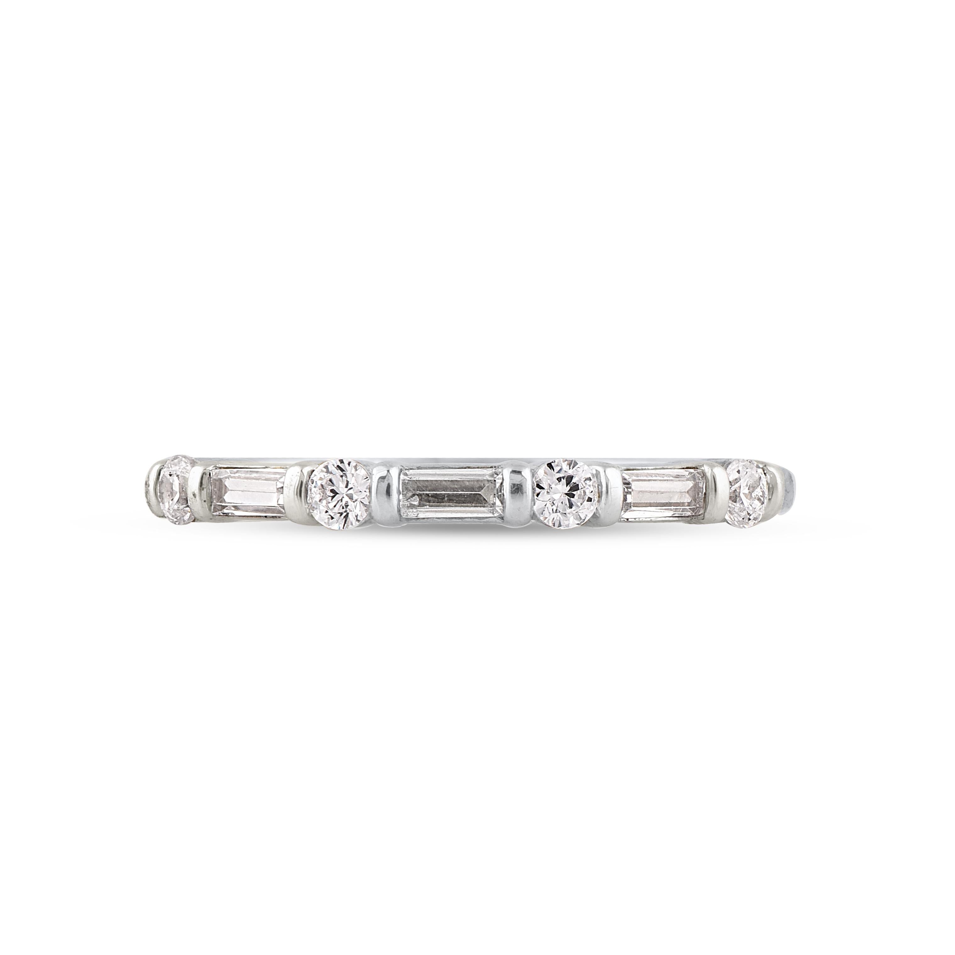 Honor your special day with this exceptional diamond band ring. This band ring features a sparkling 4 brilliant cut round diamonds and 3 baguette cut diamonds beautifully set in channel setting. The total diamond weight is 0.50 Carat. The diamonds