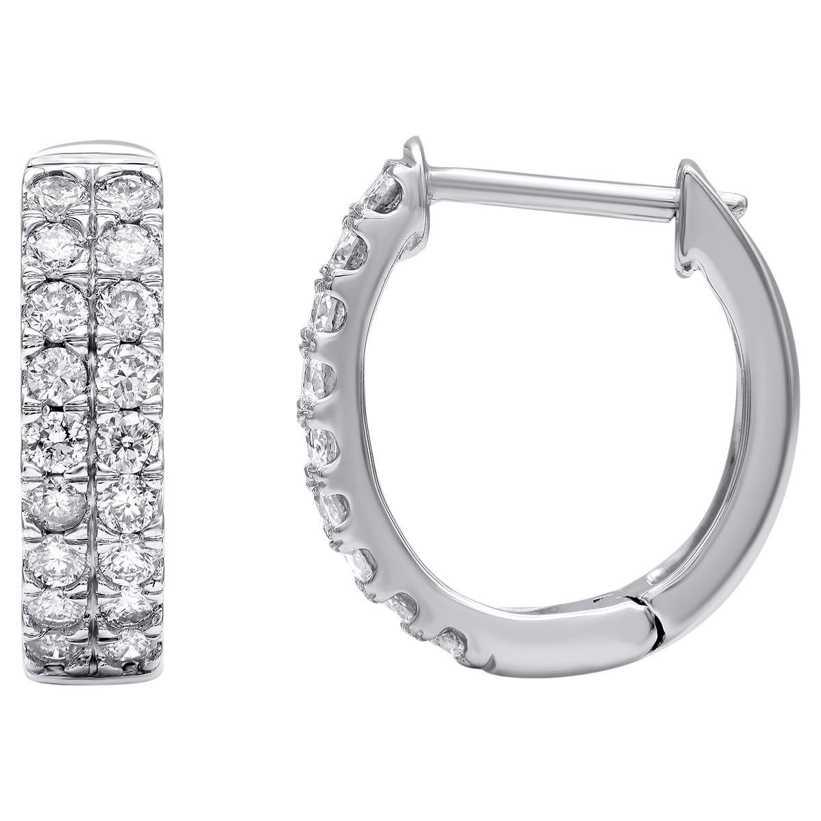 Classic and stylish diamond studded hoop earrings! perfect for daily wear. Crafted in 14 Karat white gold with 36 brilliant cut diamond in prong setting. These earring secure with hinged backs. The white diamonds are graded as H-I color and I2