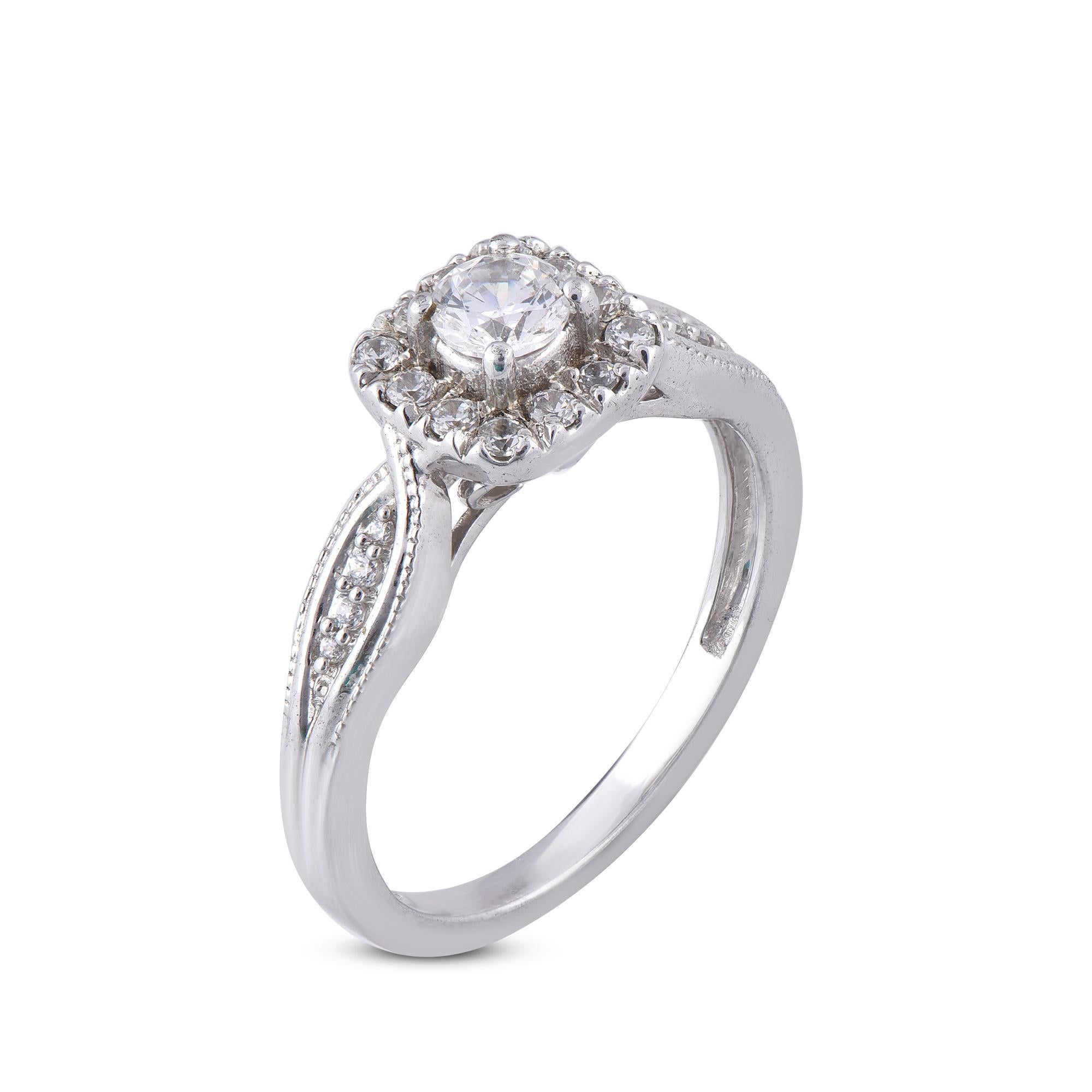 Stunning and classic, this diamond ring is beautifully crafted in 18 karat White gold. The engagement ring features 0.27 ct of centre stone and 0.23 ct diamond frame and twisted shank lined sparkling white diamonds set in secured prong settings. The