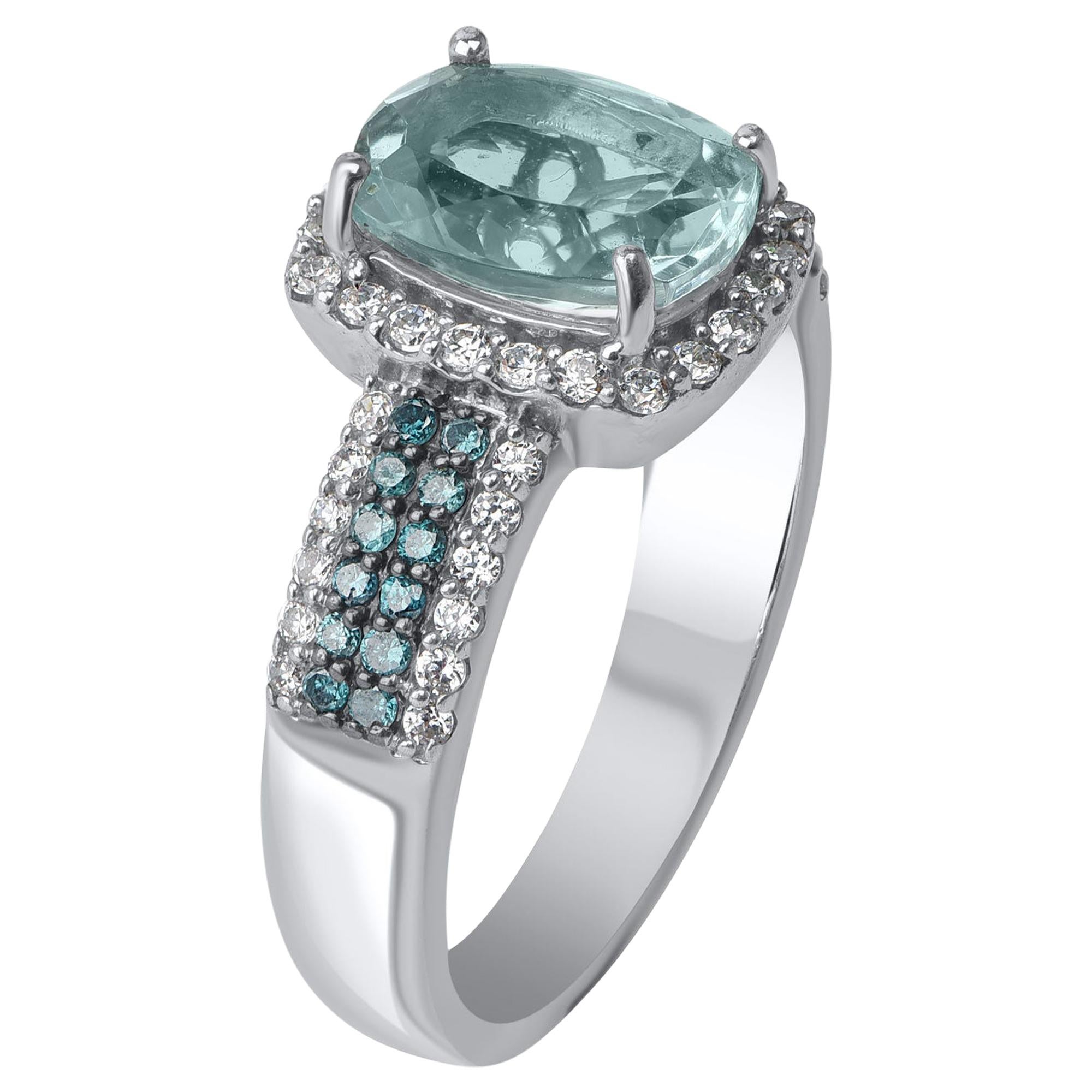 Handcrafted by our in-house experts in 14-karat white gold and embellished with 46 brilliant diamonds, 1 aqua marine gemstone and 24 treated blue diamonds in pave setting. The diamonds are graded HI color, I2 clarity. 

Current size of the ring is