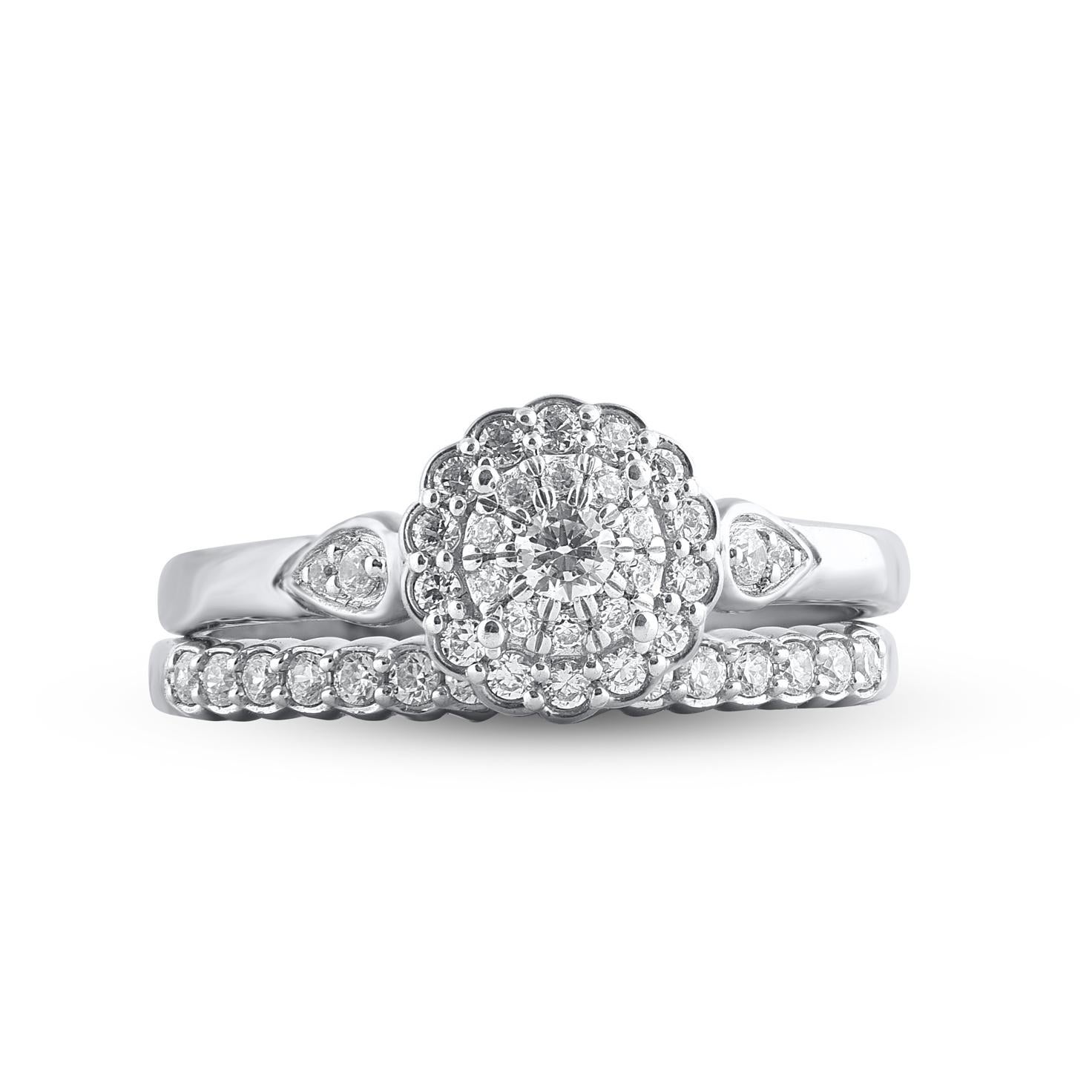 Give her a sophisticated reminder of your love with this diamond ring set. Crafted in 14 Karat white gold. This wedding ring features a sparkling 44 brilliant cut and single cut round diamonds beautifully set in prong & pave setting. The total