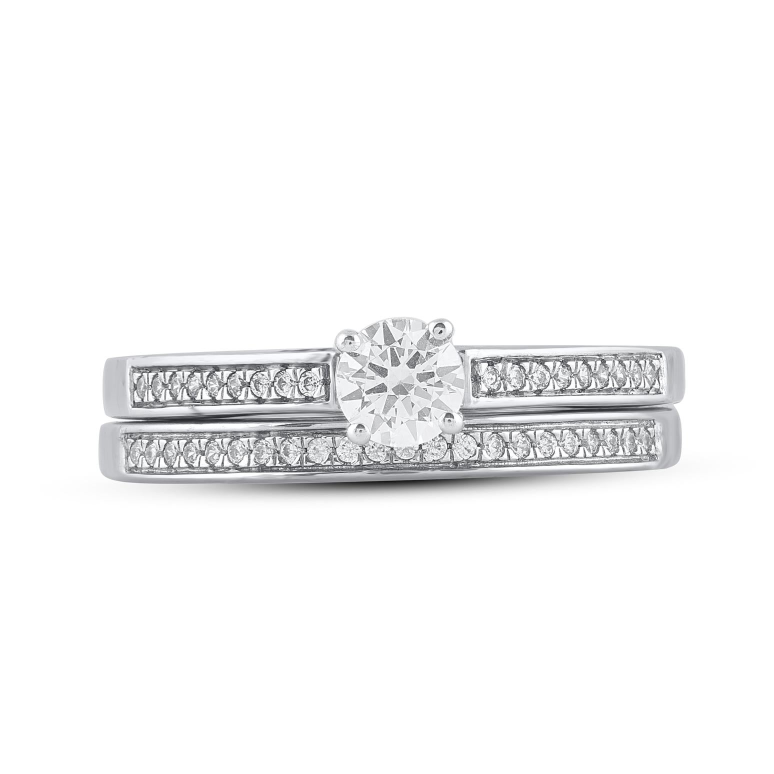 Express your love with this classic and dazzling diamond bridal set. Crafted in 14 Karat white gold. This wedding ring features a sparkling 41 brilliant cut and single cut diamonds beautifully set in prong and pave setting. The total diamond weight