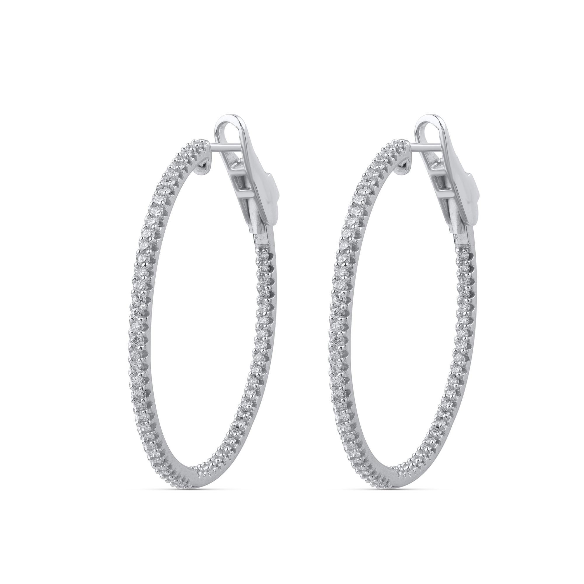 These diamond hoop earrings will brighten up your everyday look. These sleek diamond hoop earrings are accented with 122 round-cut diamonds in prong setting and hand-crafted by our in-house experts in 10 kt white gold. Diamonds are graded H-I Color,