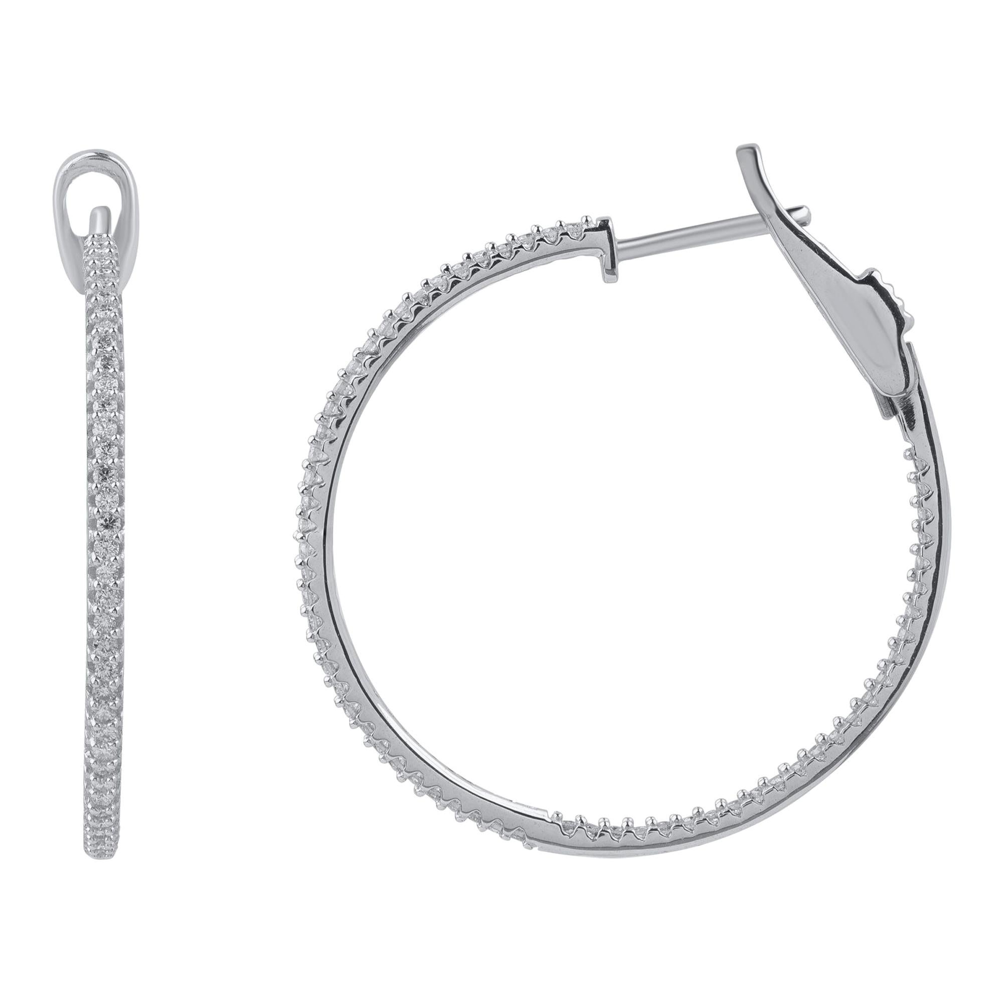 These diamond hoop earrings will brighten up your everyday look. These sleek diamond hoop earrings are accented with 122 round-cut diamonds in prong setting and hand-crafted by our in-house experts in 10 kt white gold. Diamonds are graded H-I Color,