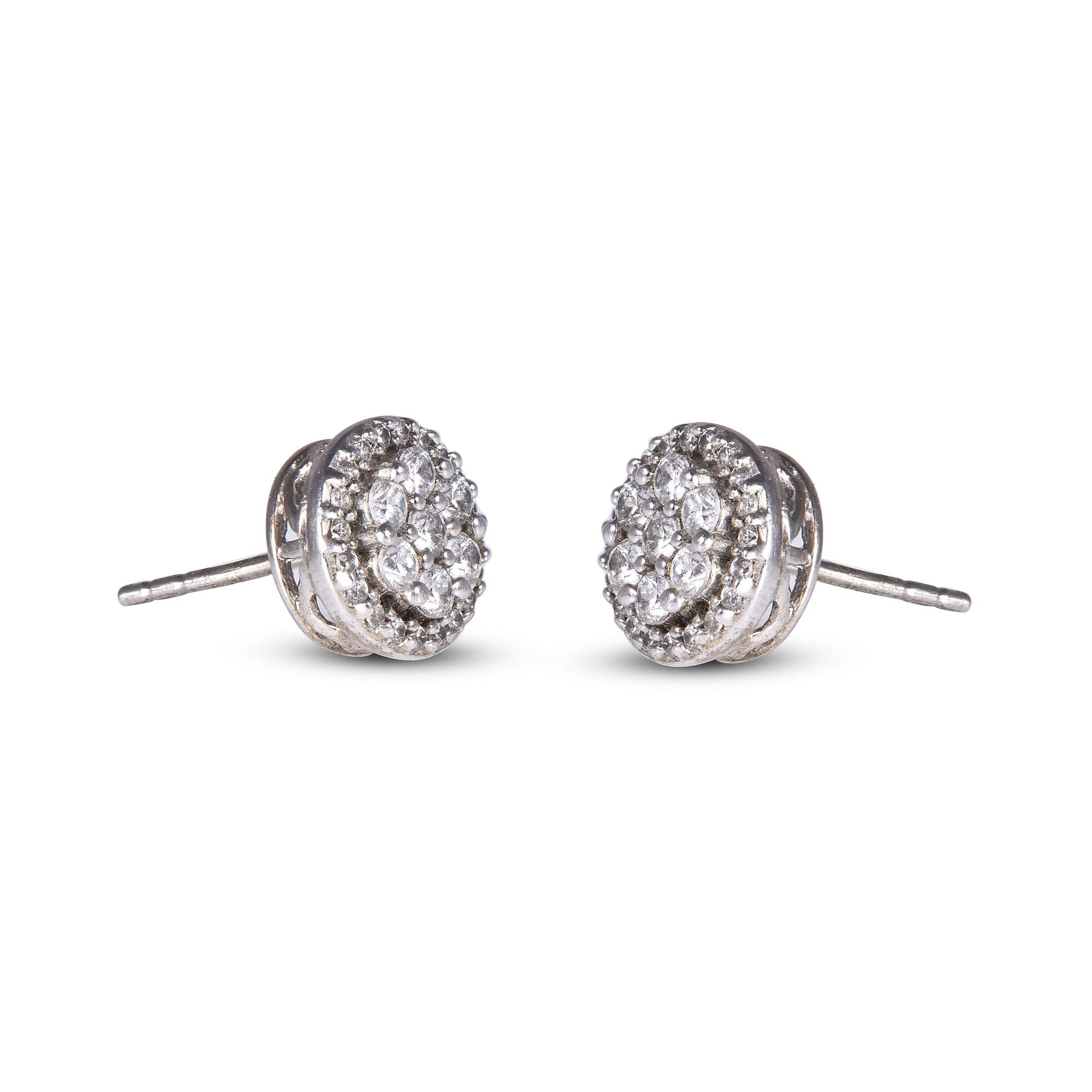 These exquisite diamond cluster stud earrings offer beauty equaled only to her own. These earrings feature 54 brilliant-cut dazzling diamonds.These timeless stud earrings top post settings that secure comfortably with post and backs. The total