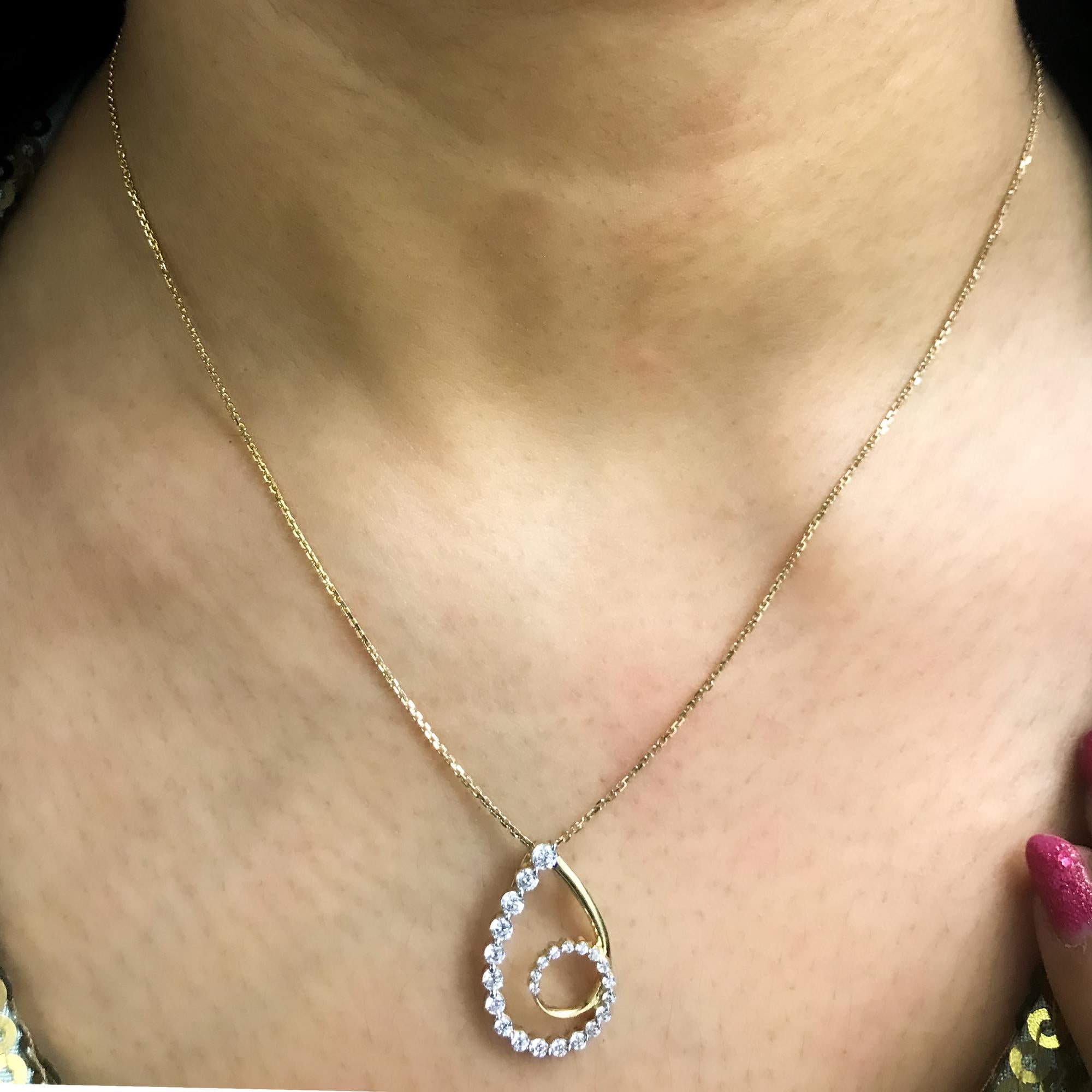Experience dazzling diamonds with this magnificent studded pendant that’s sure to steal all the attention. The pear shaped pendant is crafted from 14 karat gold in your choice of white, rose, or yellow, and features Round Brilliant 24 white