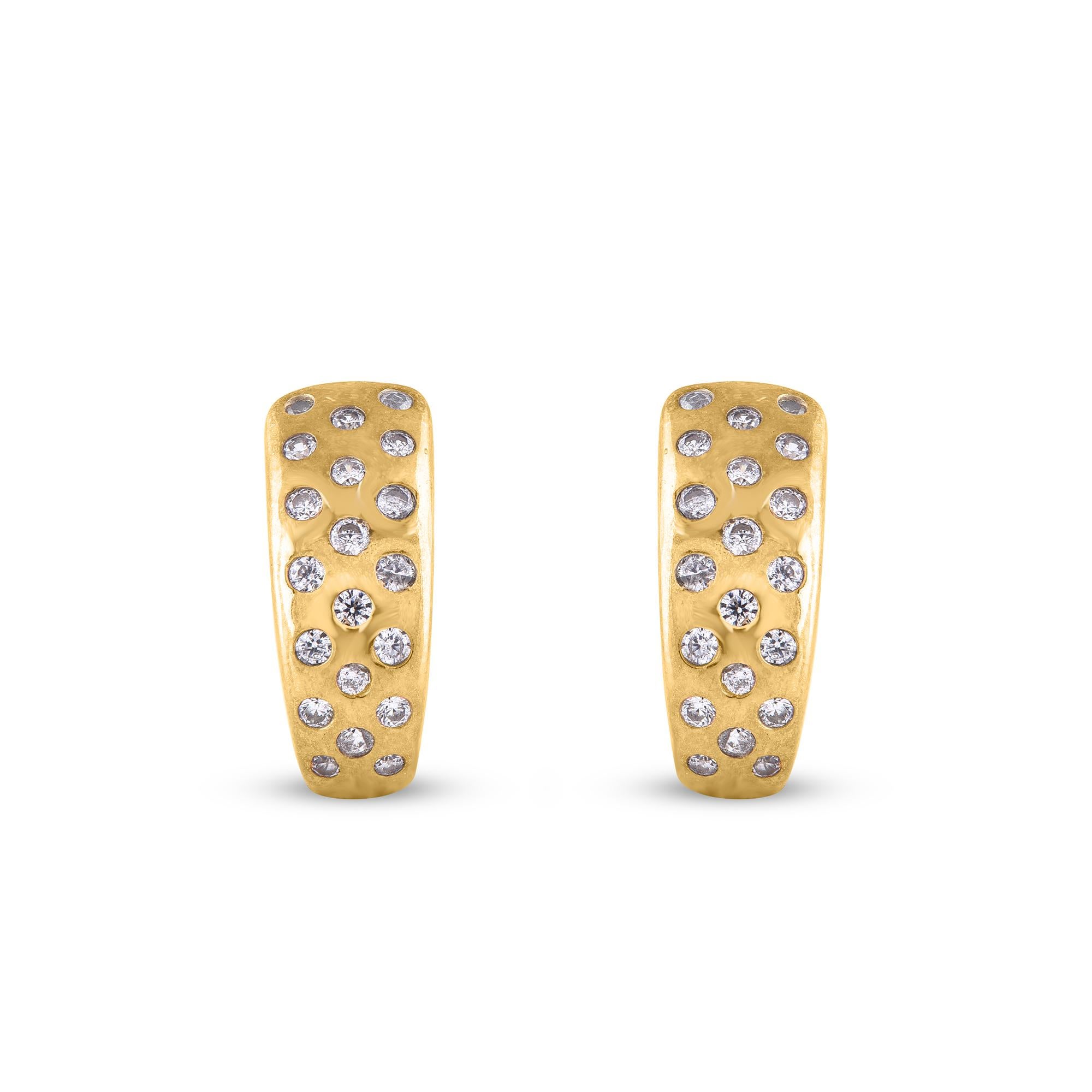 Adorn your casual wear with extra glitz when you put on these floral design stud earrings. Expertly crafted in 14 K Yellow Gold, earring is cleverly filled with 40 round diamond set in flush setting and shimmers in H-I color I2 clarity. Captivating