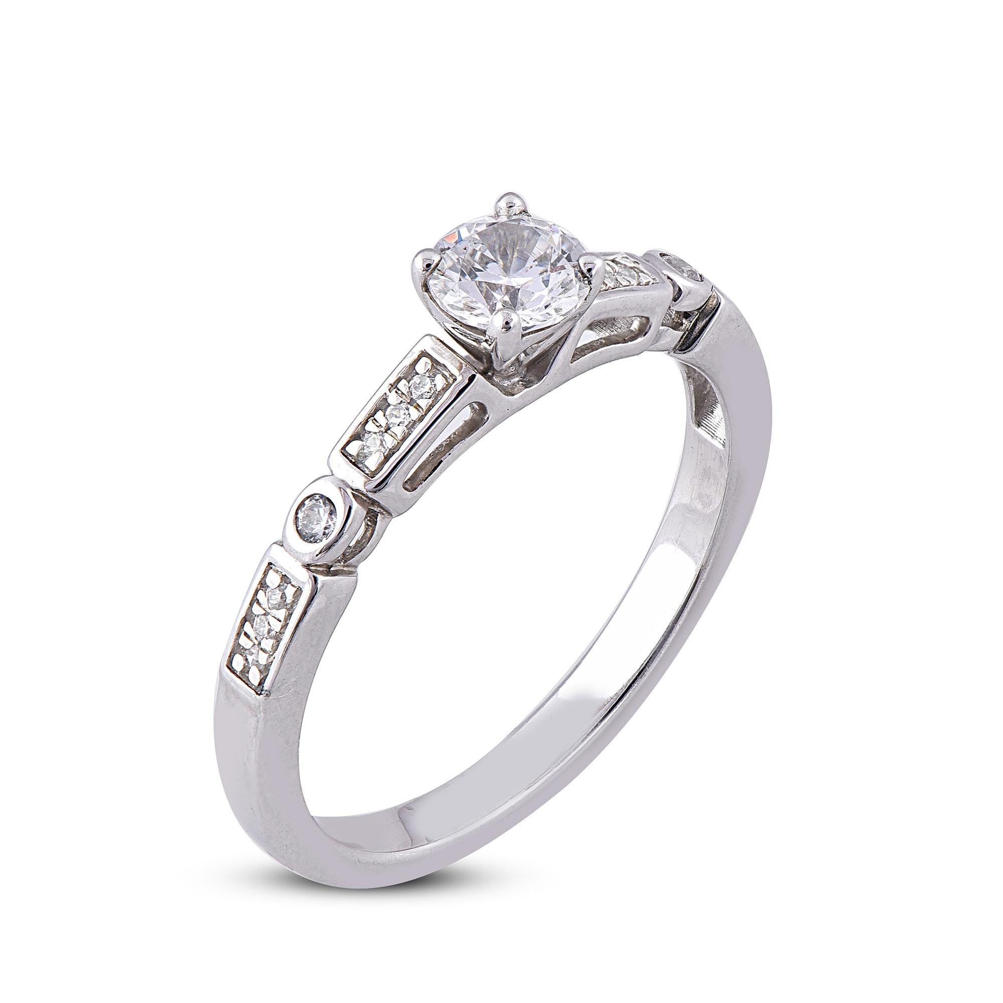 Take glamour to a whole new level with this beautiful White gold diamond engagement ring. Fashionated with 18 Karat White gold with 15 round diamonds accentuated in pave, prong and Bezel setting. We only use natural, 100% conflict free diamonds