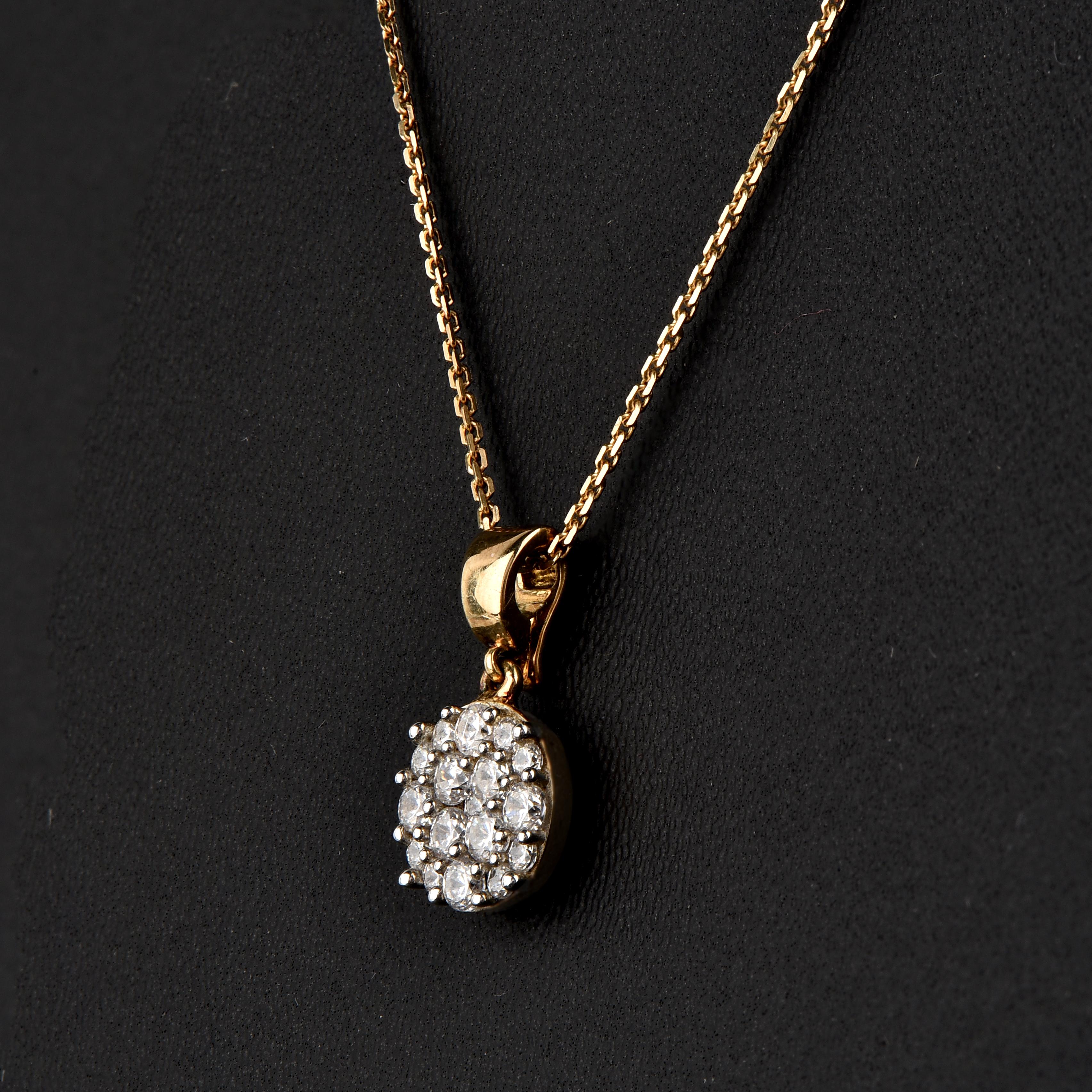 Embrace yourself with this breath-taking diamond studded pendant that is ready to make you shine. The pendant is crafted from 18-karat Yellow gold and features Round Brilliant 17 white diamonds, Pressure set, H-I color I1 clarity and a high polish