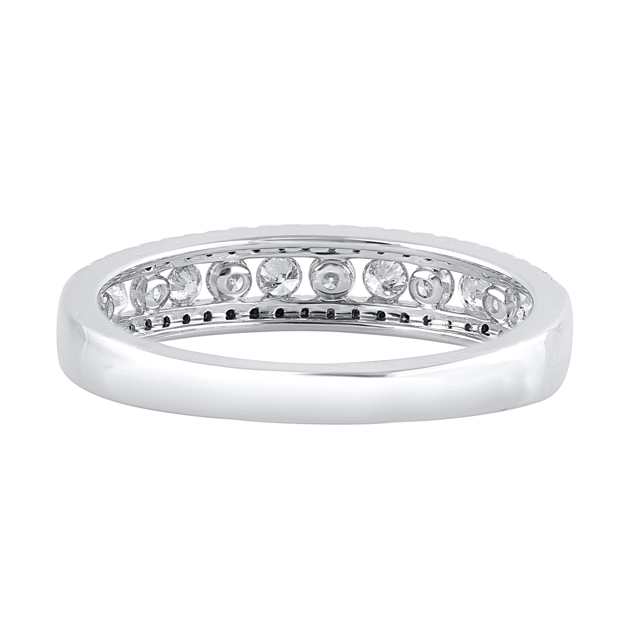 This beautiful stackable band ring features shimmering brilliant cut diamonds and treated black diamond in prong and channel setting. crafted in 14 karat white gold. The ring is studded with a total of 59 brilliant cut natural round diamonds and the