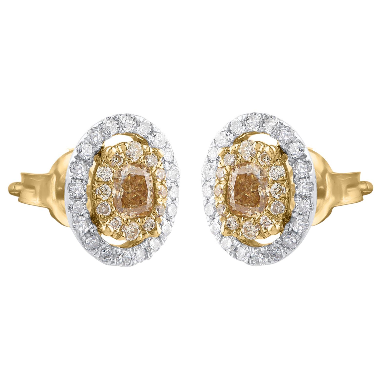These diamond accented stud earrings are crafted in 14 karat yellow gold and embedded with 40 White Diamonds, 24 Natural Yellow and 2 center stone Natural Yellow Cushion Cut diamonds beautifully set in micro-prong setting. The diamonds are graded