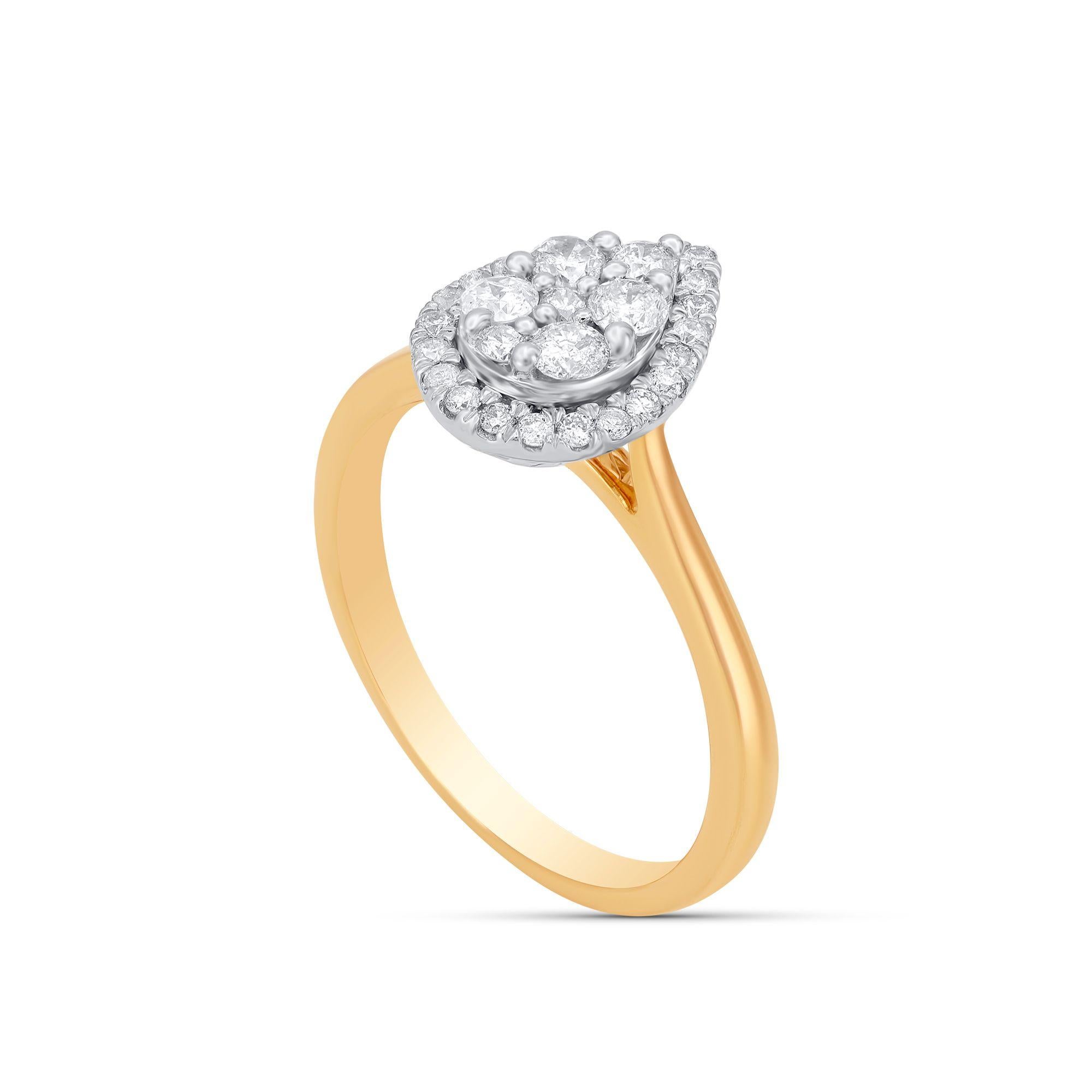 This pear shaped diamond engagement ring is crafted in 10 kt yellow gold and studded with 29 round-cut diamonds in pressure and micro-prong setting, diamonds are graded H-I Color, I2 Clarity. 
