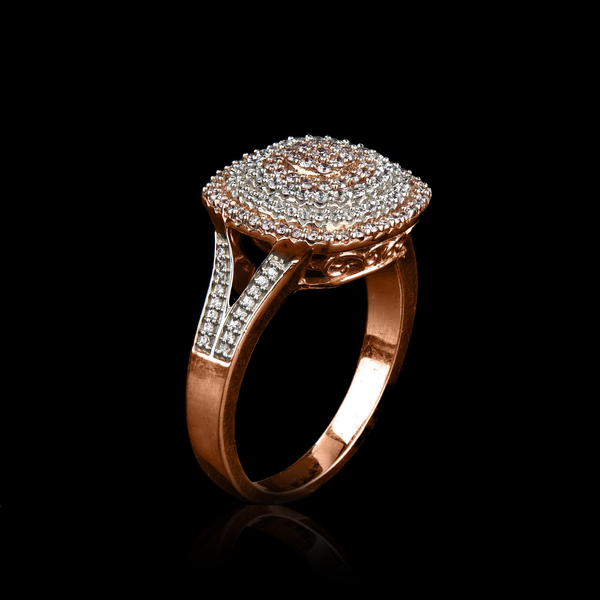 This dramatic design ring in 14K rose gold showcases 0.50 carats of sparkling 90 round and 65 natural pink rosé diamonds set in pave and micro prong setting, The diamonds are natural, not-treated and conflict-free with H-I color I1 clarity.
