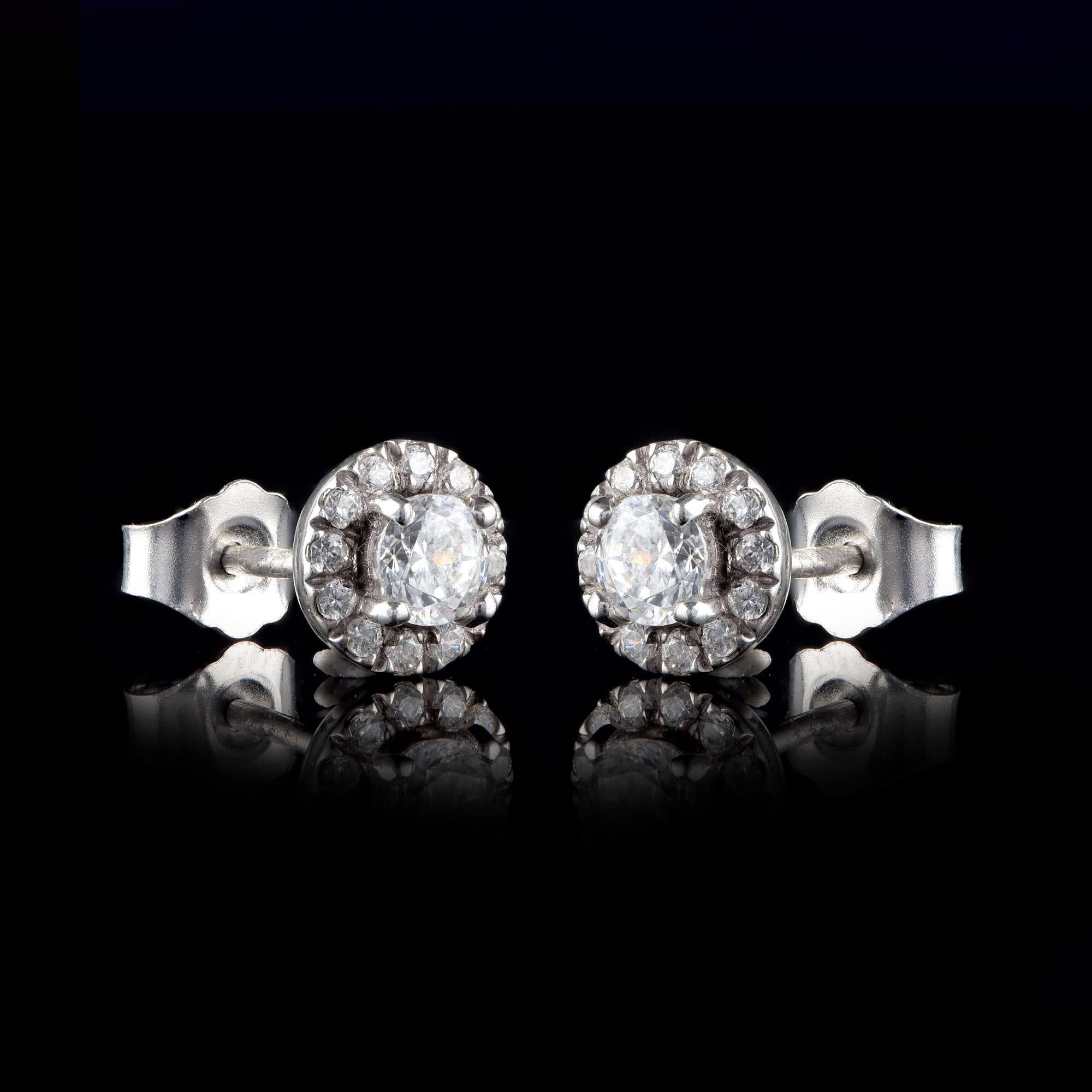 This classic design of diamonds studs features 26 brilliant-cut diamonds elegantly set in prong and micro-prong setting and designed in 18 KT White Gold. Diamonds are graded H- Color, I1 Clarity. 

Metal color can be customized on request. 

This