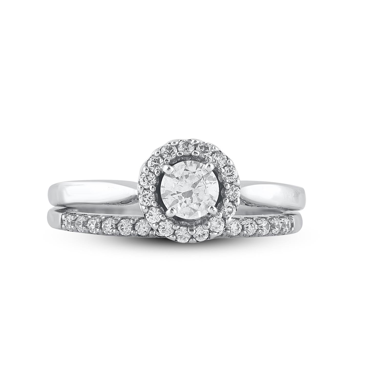 Express your love for her in the most classic way with this diamond ring set. Crafted in 14 Karat white gold. This wedding ring features a sparkling 31 brilliant cut round diamond beautifully set in prong setting. The total diamond weight is 0.65