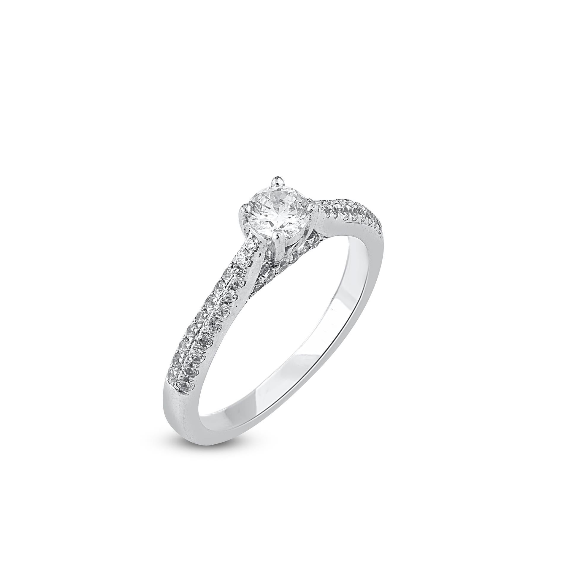 Truly exquisite, this 0.33 ct of center stone and 0.33 ct of lined shank diamond ring is sure to be admired for the inherent classic beauty and elegance within its design. The total weight of diamonds 0.66 carat, G-H color, SI1 clarity and studded