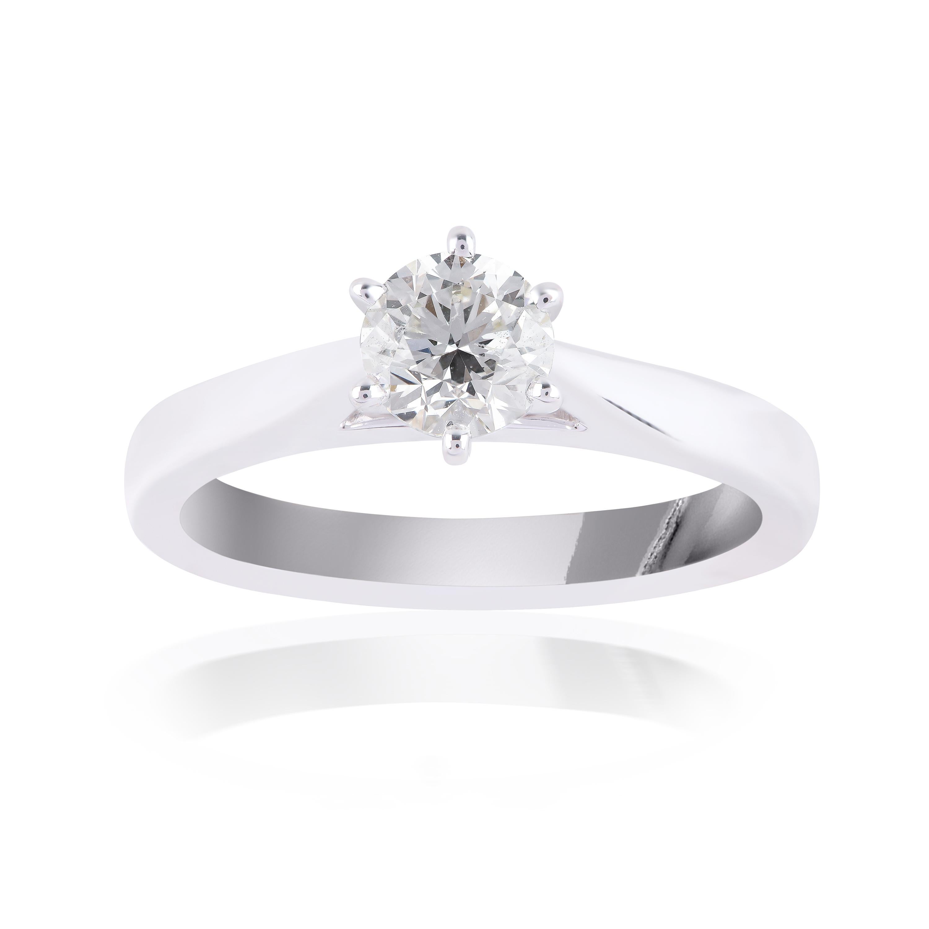 This beautiful wedding ring is made in 18-karat white gold and accentuated with 1 brilliant cut diamond in prong setting. The diamond is graded G-H Color, VS Clarity.
