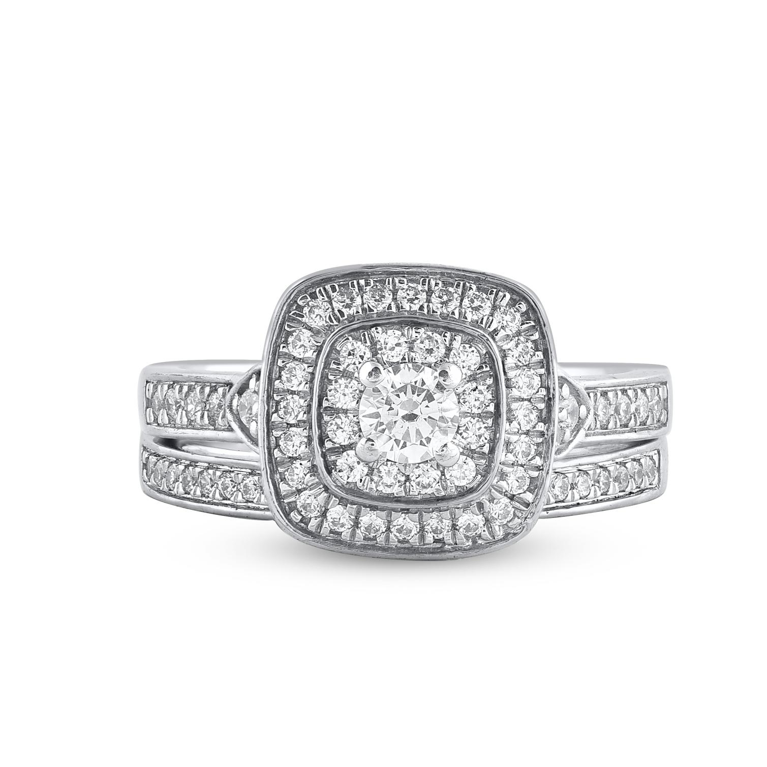Bringen Sie Ihre Liebe mit diesem klassischen und traditionellen Diamant-Braut-Set zum Ausdruck. Gefertigt aus 14 Karat Weißgold. In diesem Ehering funkeln 74 Diamanten im Brillantschliff und runde Diamanten im Einzelschliff in wunderschöner