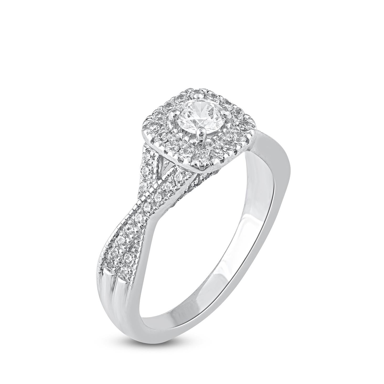 Bring charm to your look with this diamond engagement halo ring. This ring is beautifully crafted in 14 Karat white gold and studded with 77 single cut round and brilliant cut diamonds in prong and bezel setting. Total diamond weight is 0.75 carat.