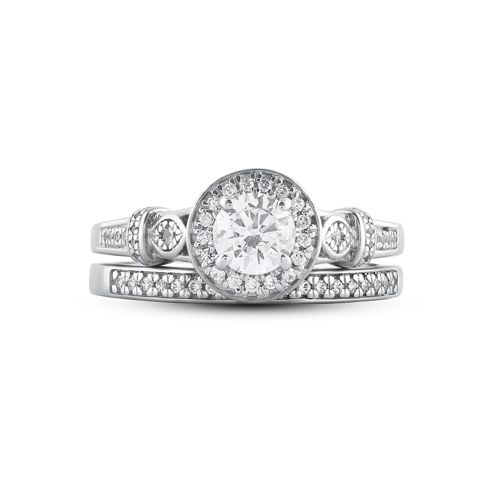 Express your love in the sweetest way with this round-cut diamond frame bridal set. Crafted in 14 Karat white gold. This wedding ring features a sparkling 59 brilliant cut and single cut round diamonds beautifully set in prong, pave and bezel