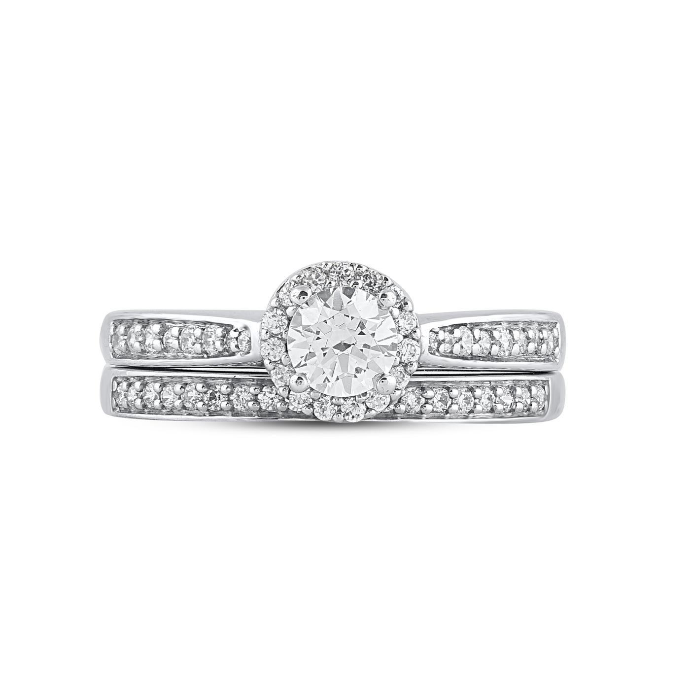Win her heart with this classic and elegant diamond ring. Crafted in 14 Karat white gold, the engagement ring features a sparkling 51 single cut & brilliant cut diamond beautifully set in prong & pave setting. The total diamond weight is 0.75 Carat.