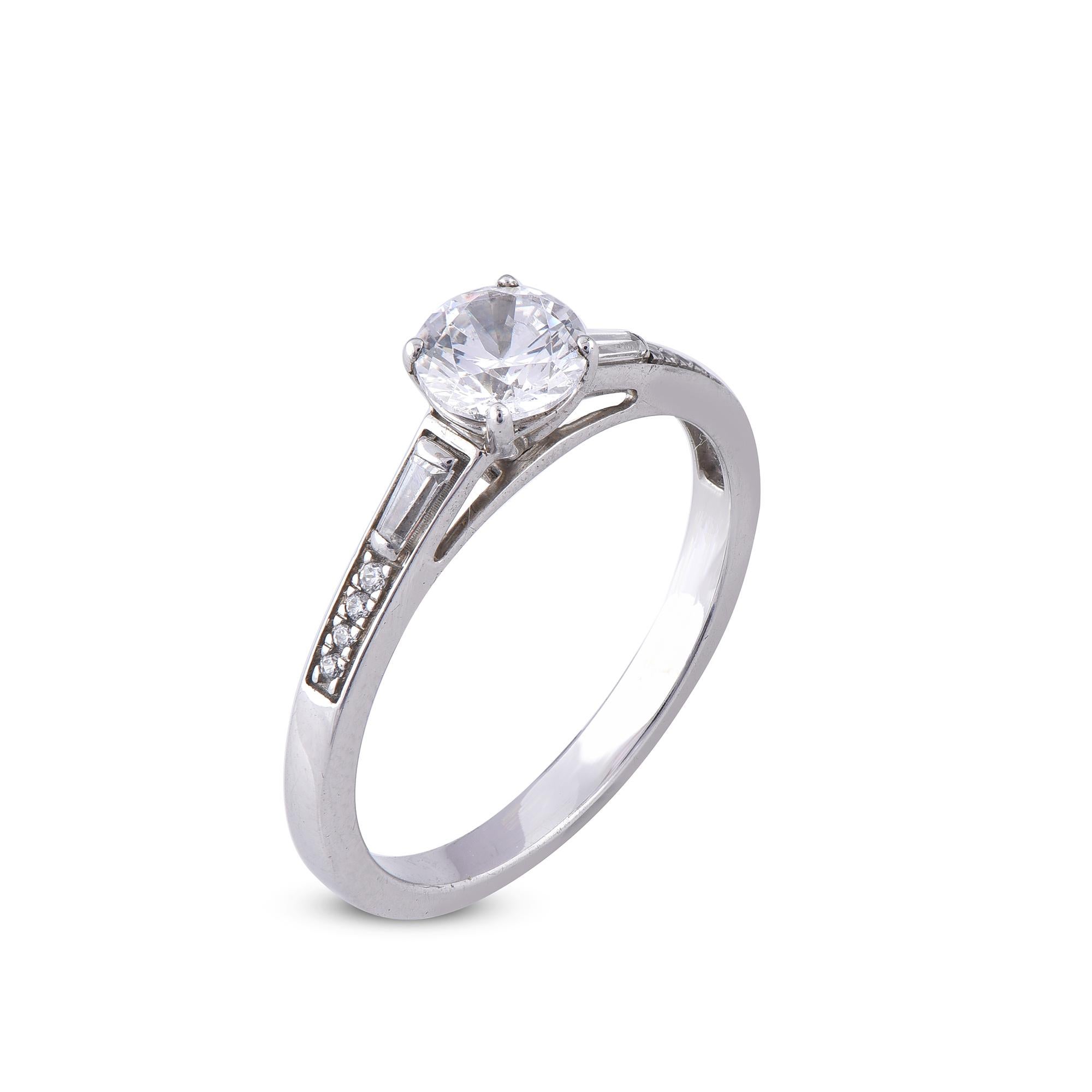 Stunning and classic, this diamond ring is beautifully crafted in 18 Karat White gold. It features 0.75 ct of 9 round and 2 Baguettes diamonds in secured Pave, prong and channel settings. The diamonds are natural, not-treated and conflict-free with