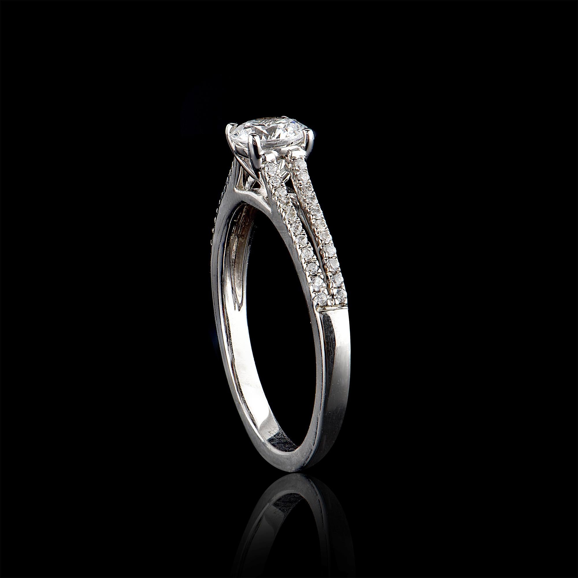 Give a touch of glamour to your fine jewelry collection with this diamond petal engagement ring. It features 0.60 ct center stone and 0.15 ct round brilliant diamond on split shank set in micro pave and channel setting. The diamond are natural, not