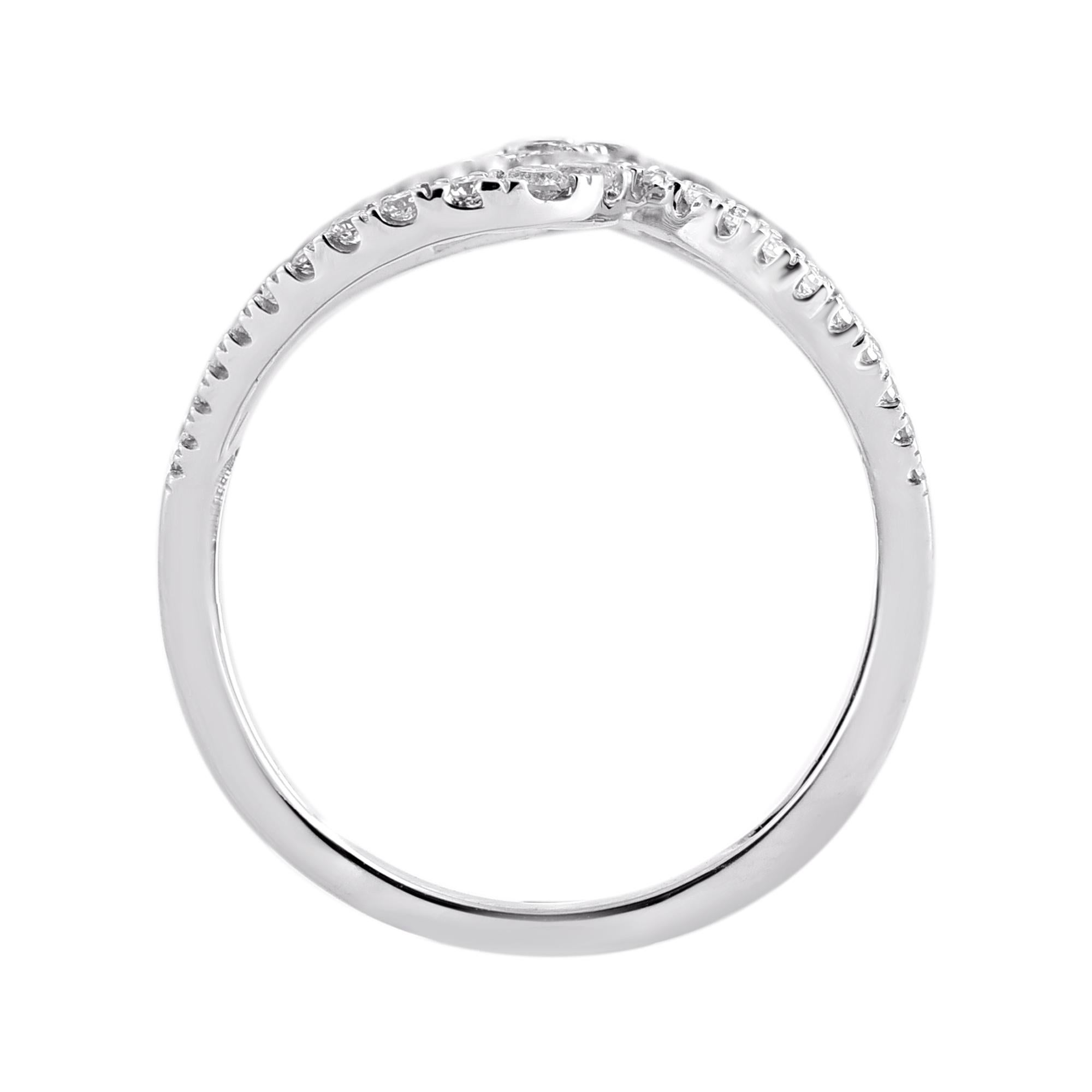 Express your unique style with this diamond bypass ring. This ring is beautifully designed and crafted in 14kt white gold with 93 natural round diamonds in prong setting. The total weight of diamonds 0.75 carat, H-I Color and I2 Clarity. This band