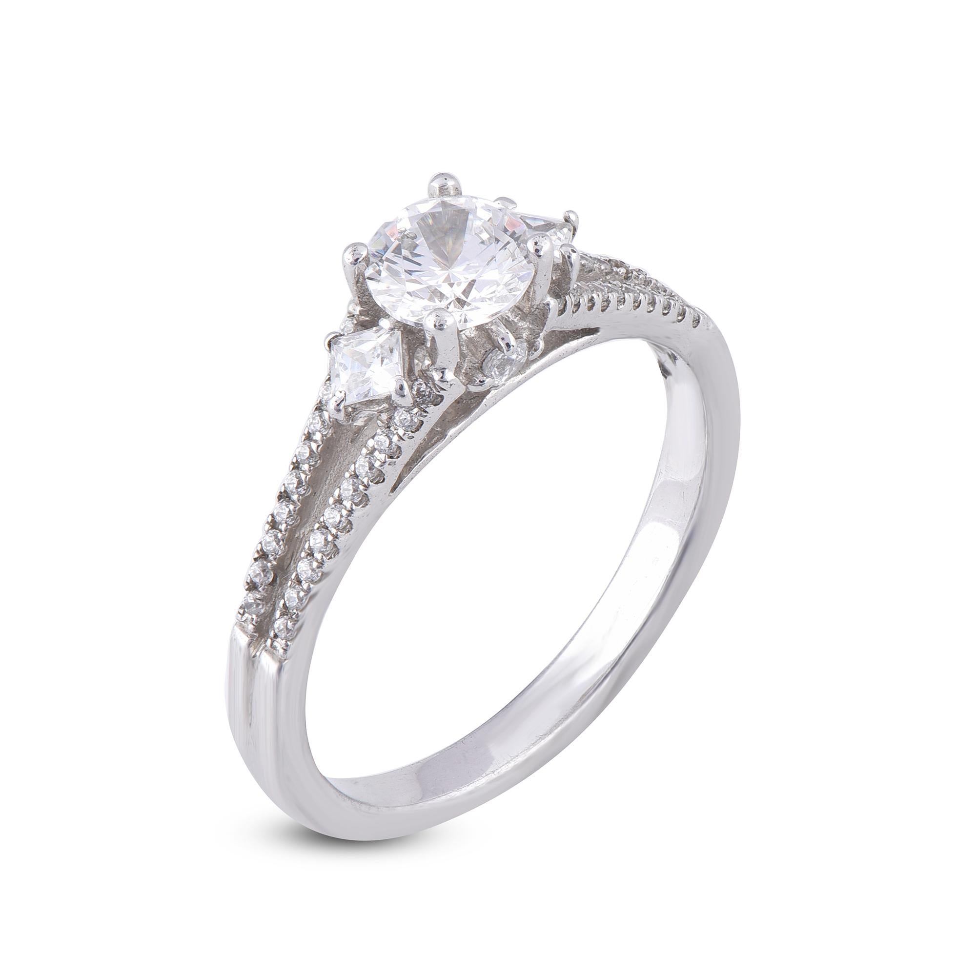 Truly exquisite, this diamond engagement ring is sure to be admired for the inherent classic beauty and elegance within its design. This diamond frame ring showcase 0.52 ct round centre stone and 2 princess cut stone with 0.0875 ct of surrounded