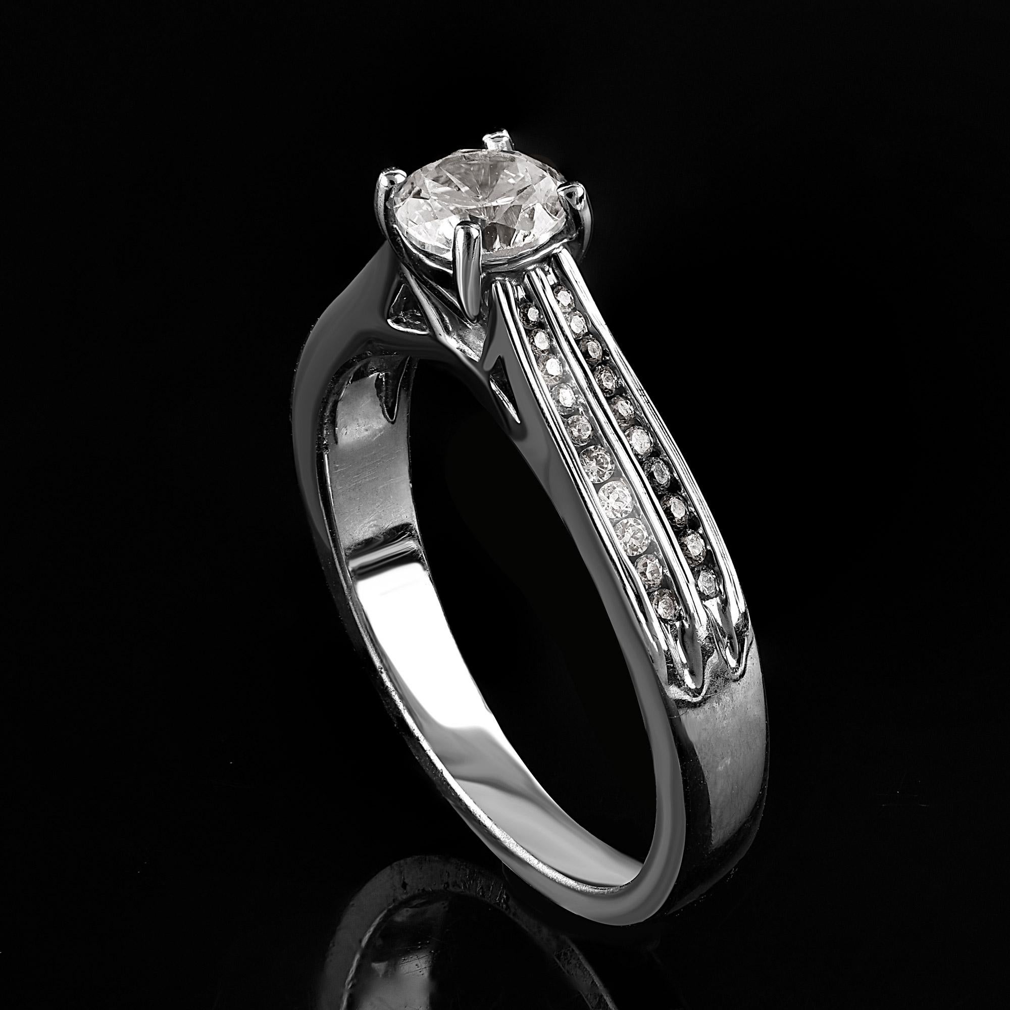 Beautiful Round Natural Diamond Band Ring. This ring is beautifully designed and features 0.65 ct of centre stone and 0.20 ct of double shank lined diamond set in prong and channel setting. The diamond are natural, not treated and dazzles in G-H