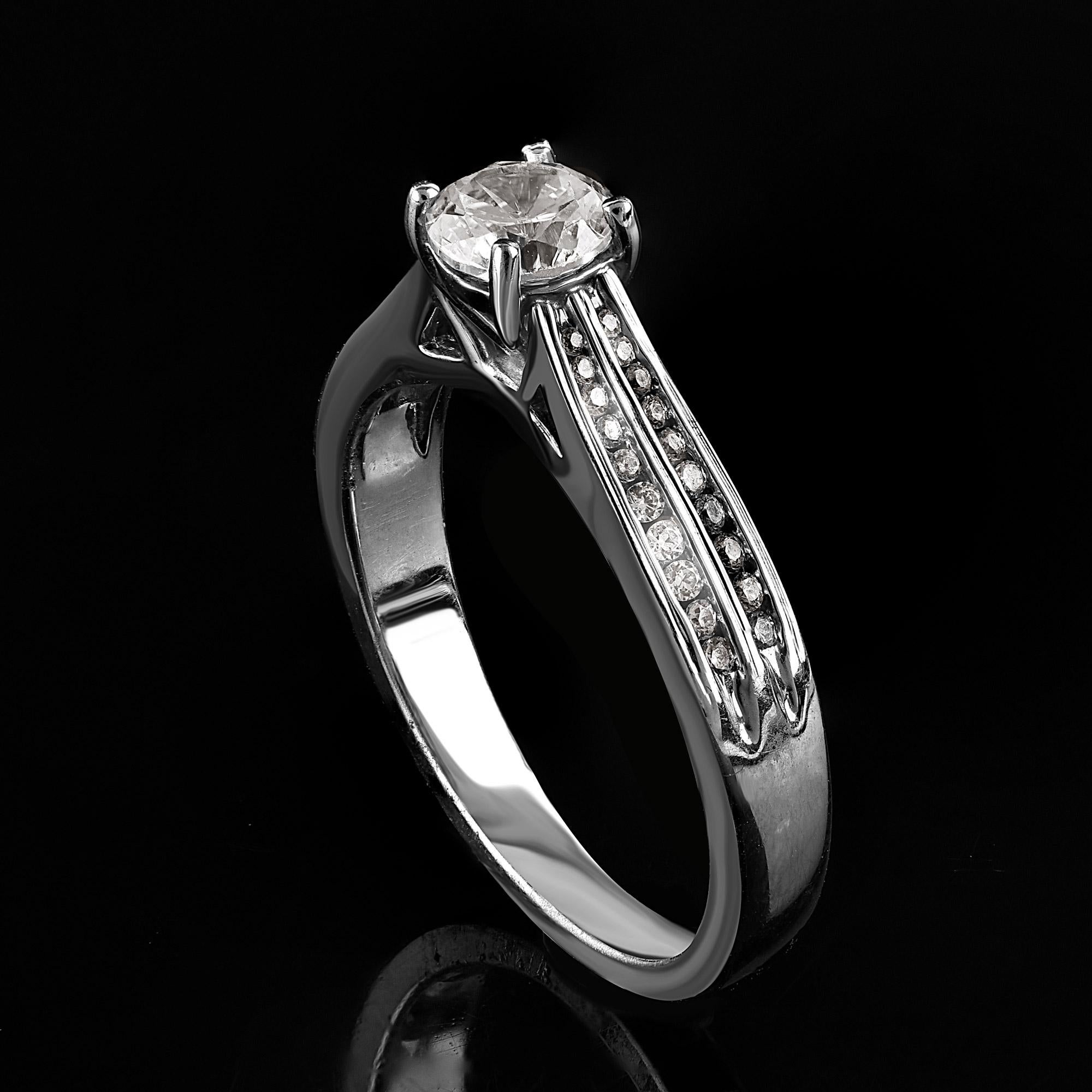 Beautiful Round Natural Diamond Band Ring. This ring is beautifully designed and features 0.65 ct of center stone and 0.20 ct of double shank lined diamond set in prong and channel setting. The diamond are natural, not treated and dazzles in G-H