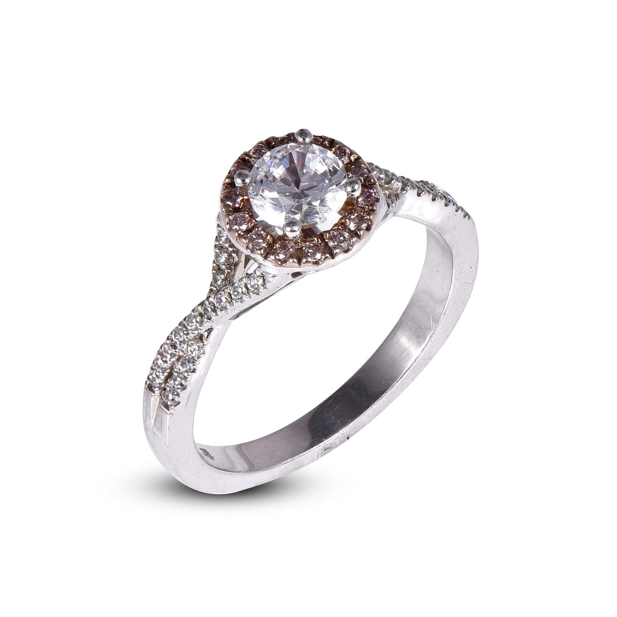 Stunning and classic, this diamond ring is beautifully crafted in 18K Solid White gold. The engagement ring features 0.50 ct of centre stone and 0.35 ct pink diamond frame and twisted shank sparkling white diamonds set in secured prong and