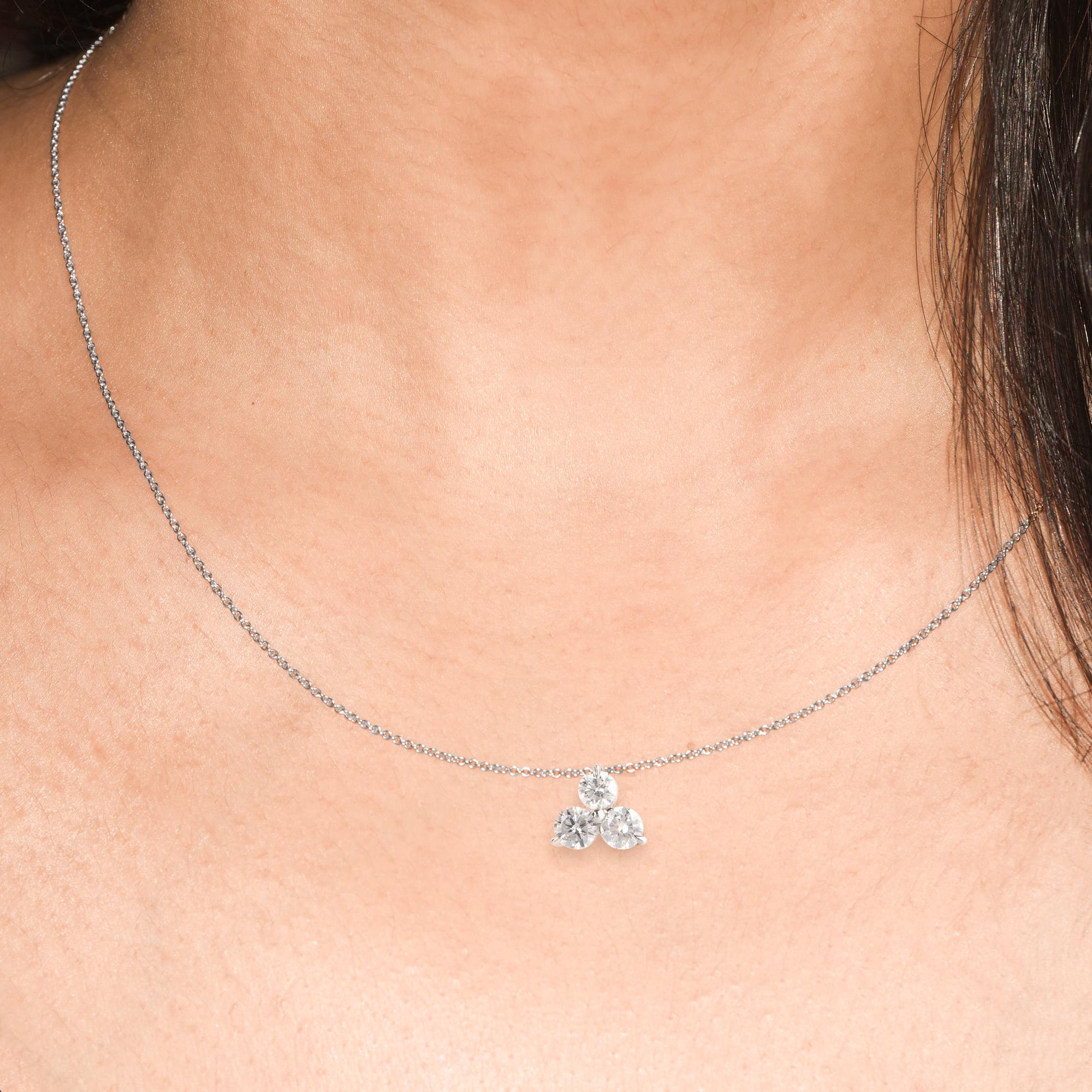 This diamond pendant glitter with 3 brilliant-cut diamonds set in prong setting and handcrafted in 14-karat white gold. The diamonds are graded HI Color, I1 Clarity.  This elegant pendant can be customized in yellow and rose gold on request. 