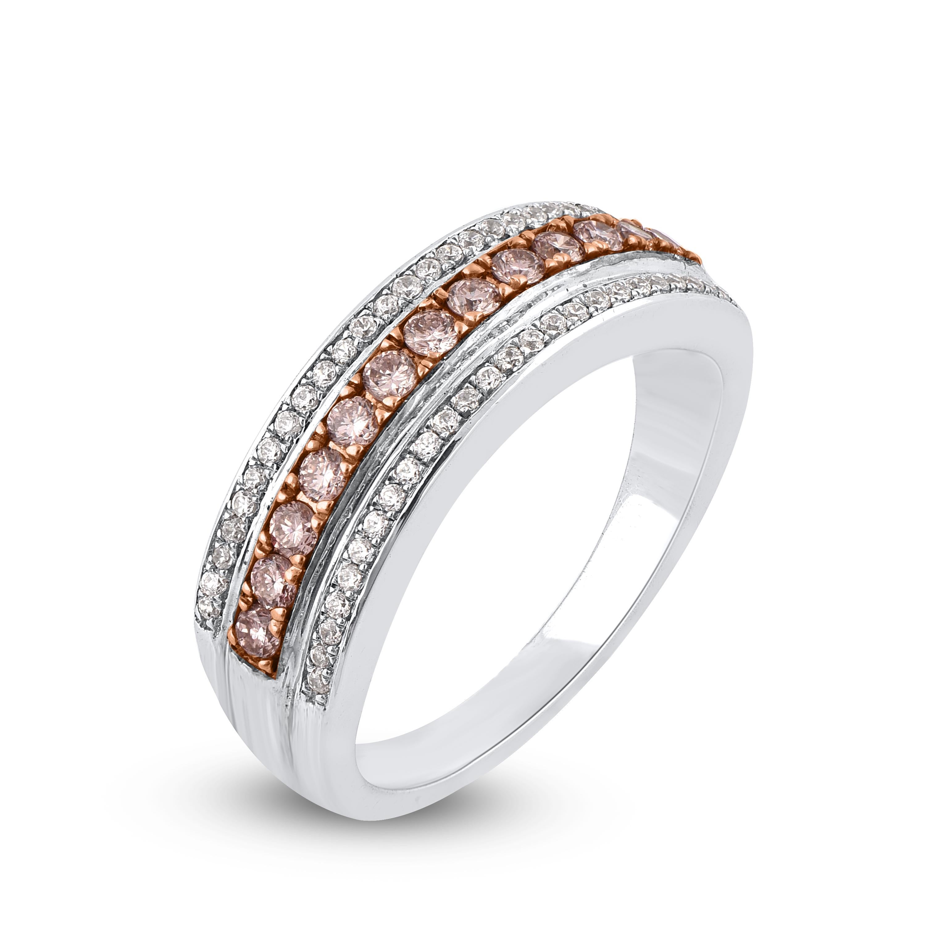 This Wide Wedding Band is expertly crafted in 18 Karat white gold and features 50 white and 13 pink diamonds set in a beautiful design in micro pave setting. We only use 100% natural and conflict free diamonds which sparkles in H-I color I1 clarity.